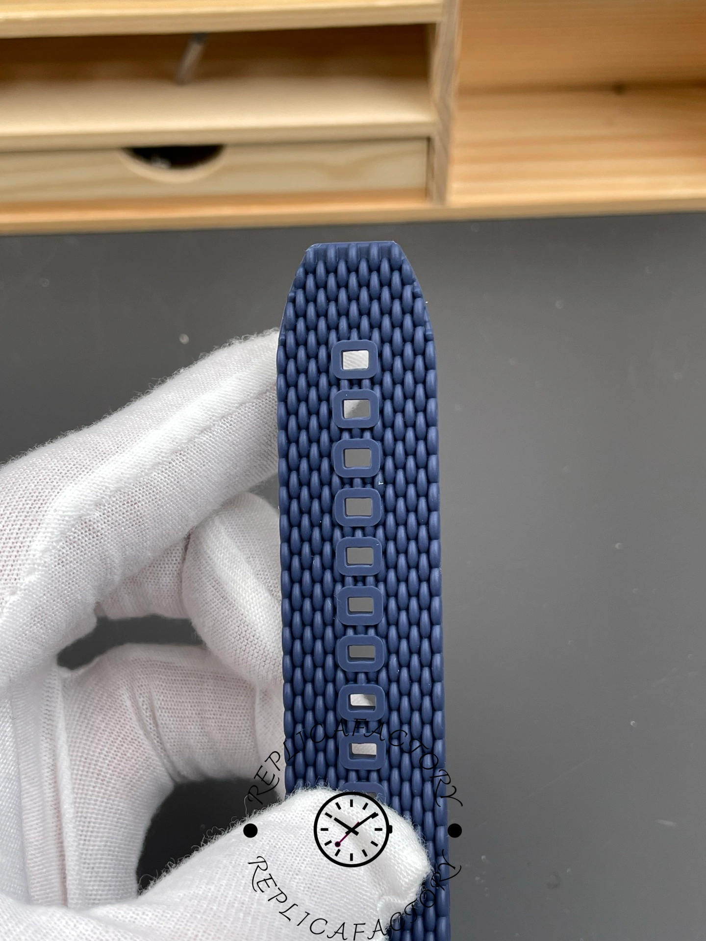 Breitling UB3112161C1S1, strap close-up showing perforations, texture, and stitching details.