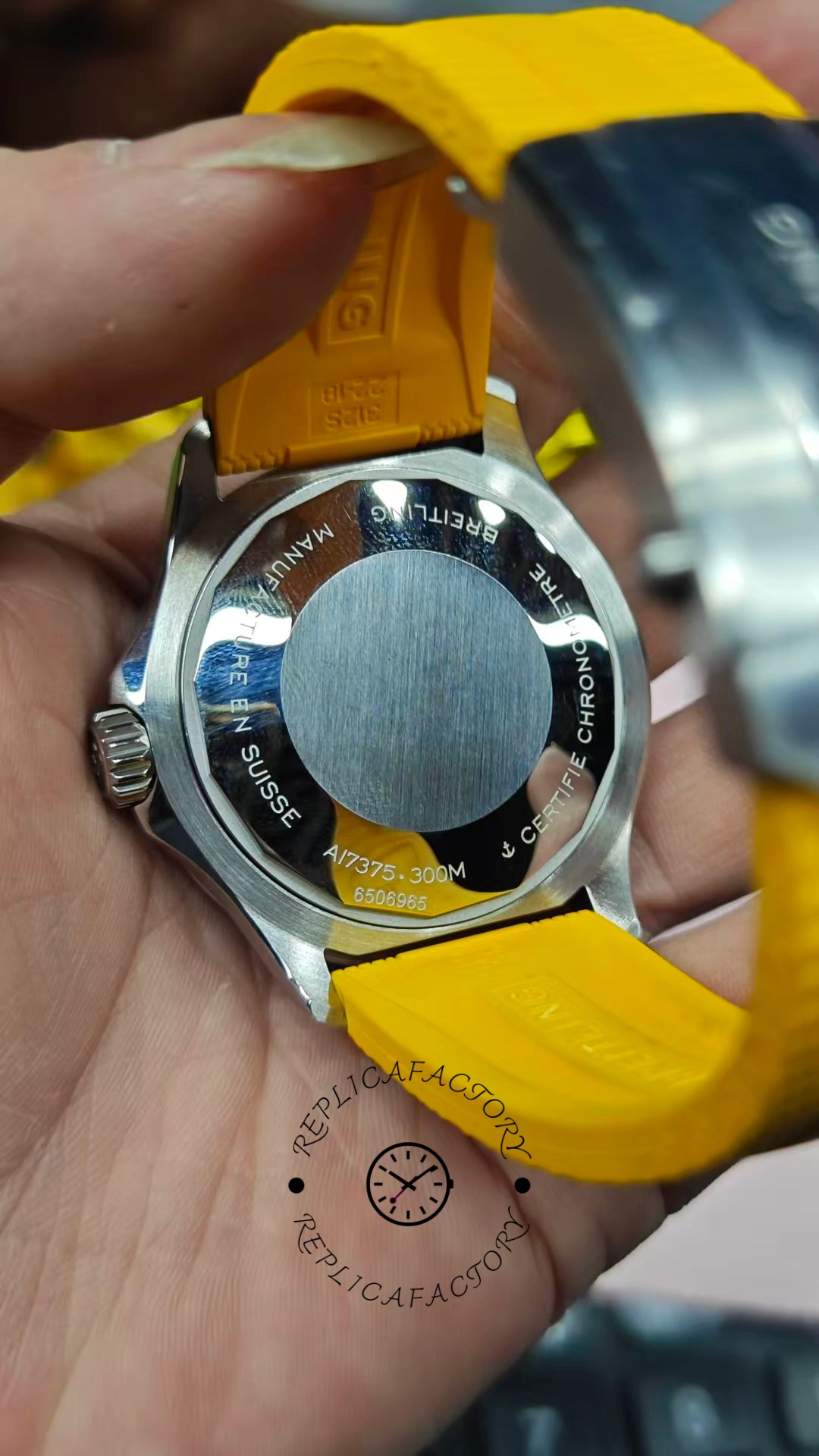 Hand-held caseback angle of Breitling Superocean Automatic A17375211B2S4 showing lugs and strap attachment.