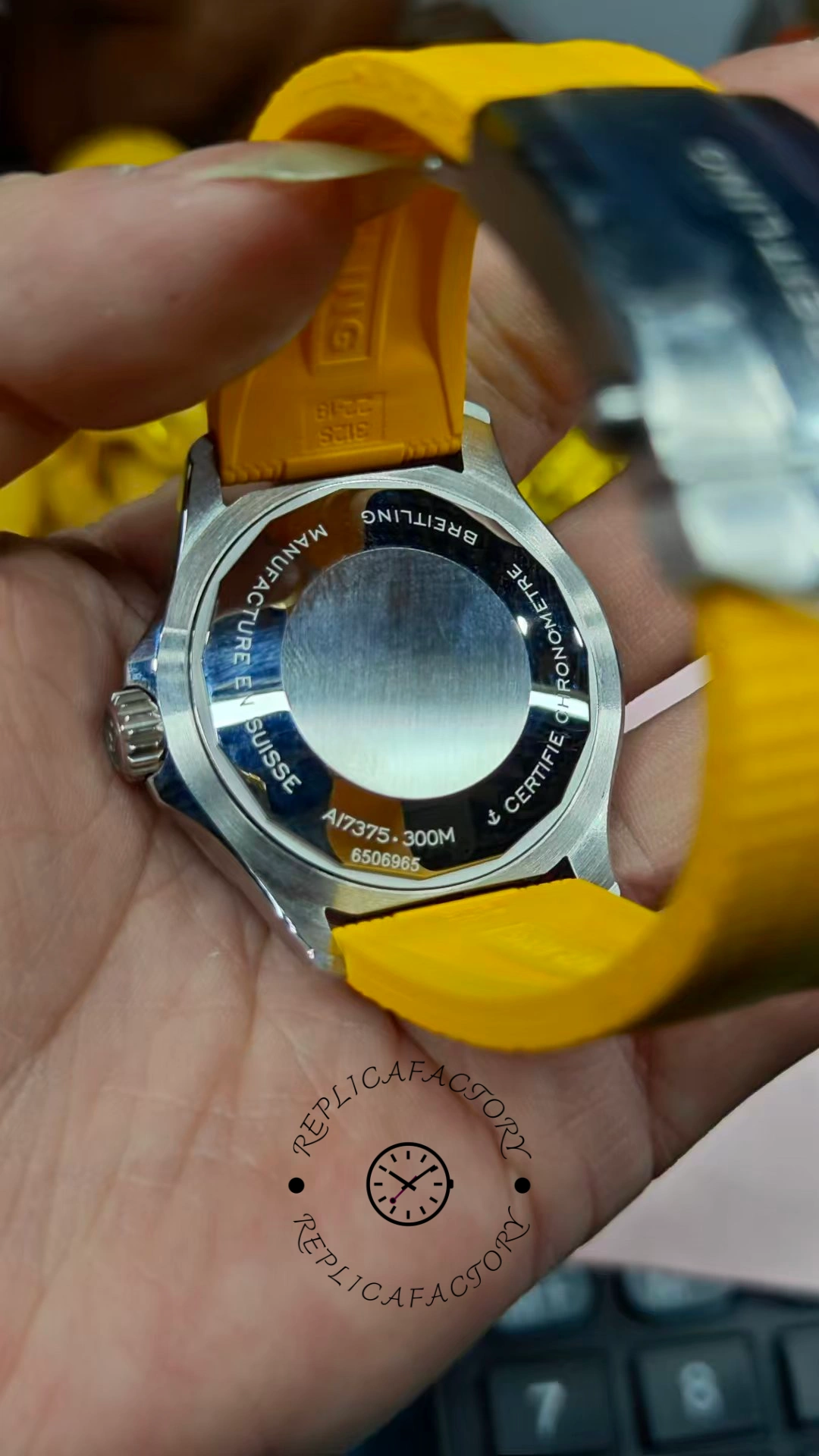 Caseback view of Breitling Superocean Automatic A17375211B2S4 showing engraved back and yellow strap.