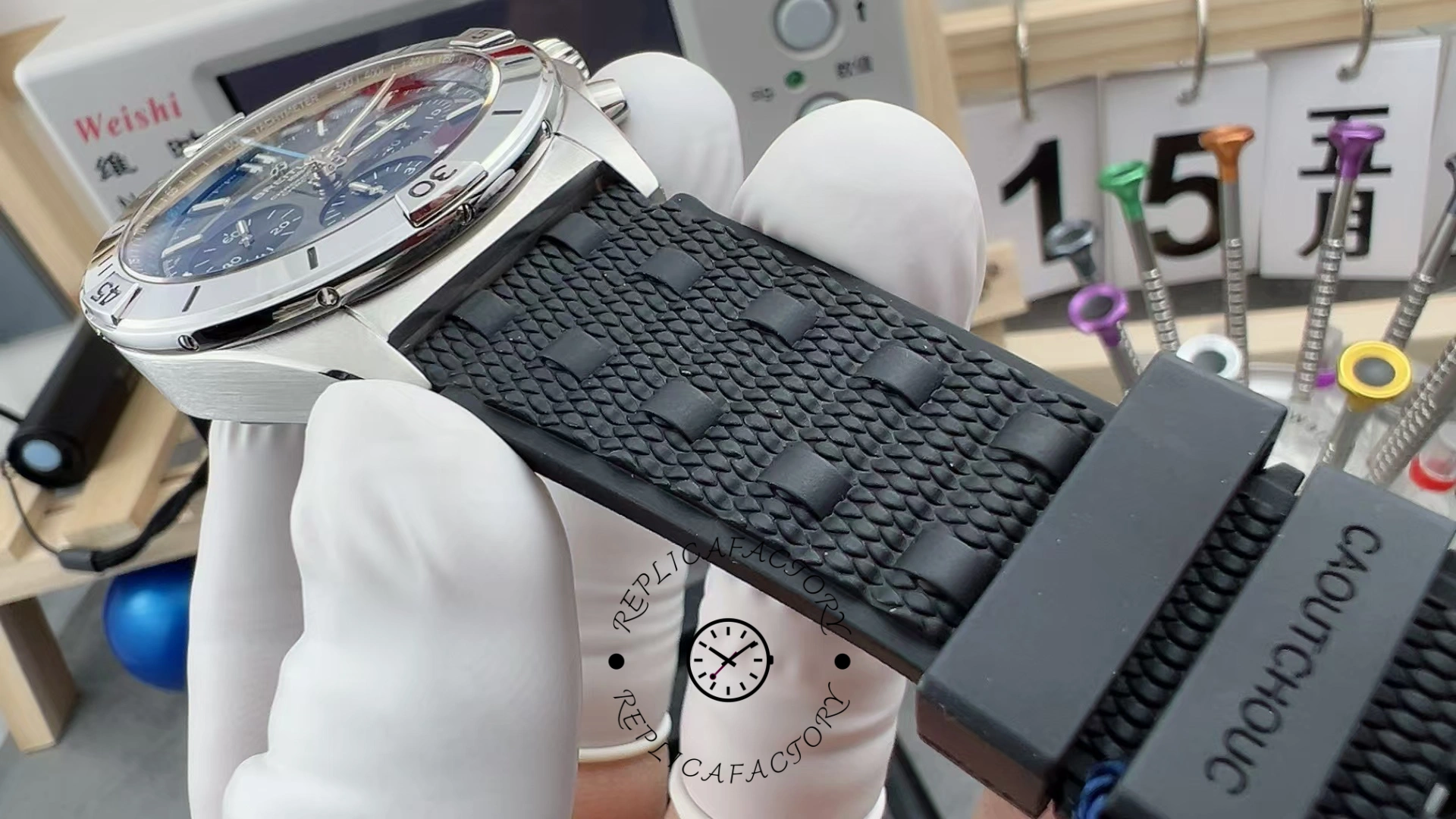 Rubber strap detail of Breitling Chronomat B01 EB0134101M1S1 showing textured strap and clasp holes.