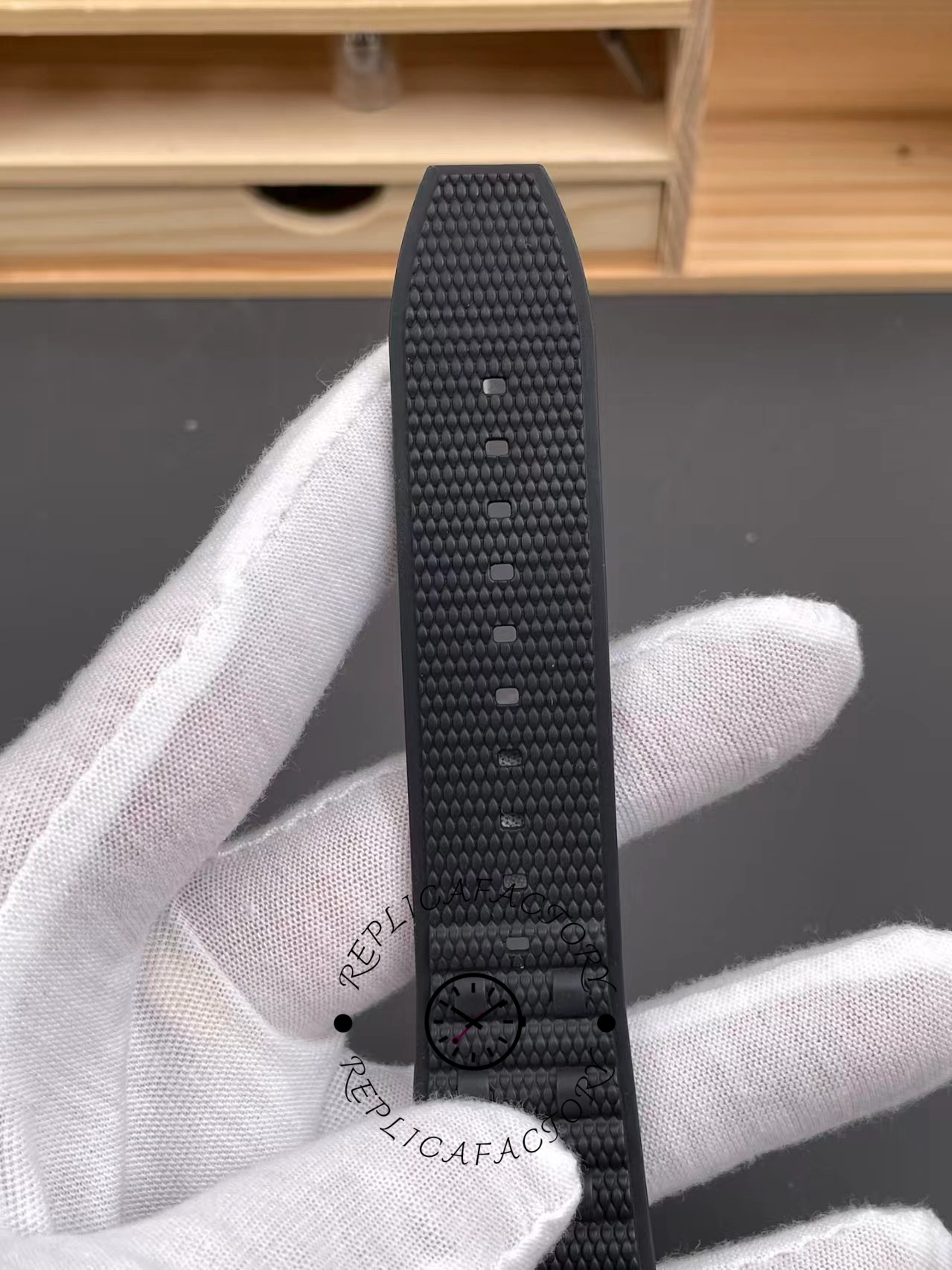 Breitling Chronomat B01 42 UB0134101B1S1, rubber strap texture and holes close-up.