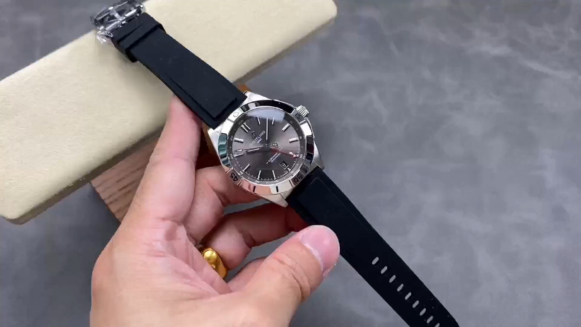 Breitling Chronomat GMT A32398101M1A1, video showing dial and rubber strap on cushion. - Video