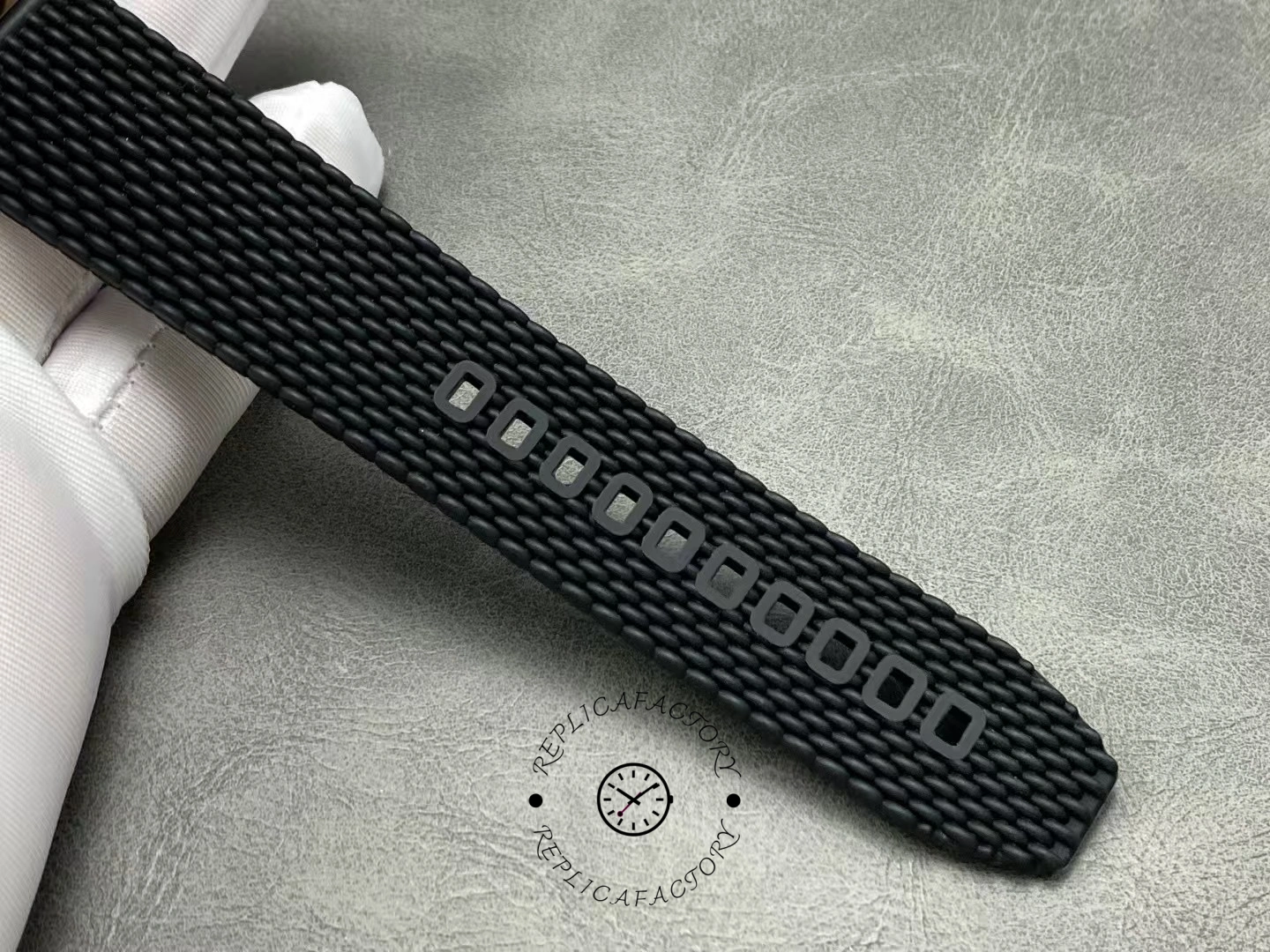 Breitling RB2010121B1S1, strap texture close-up showing black mesh surface pattern.
