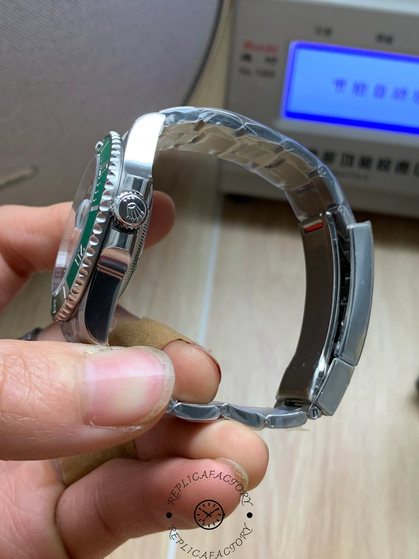 Rolex Submariner 126610LV, side angle showing crown, bezel height and case curvature.