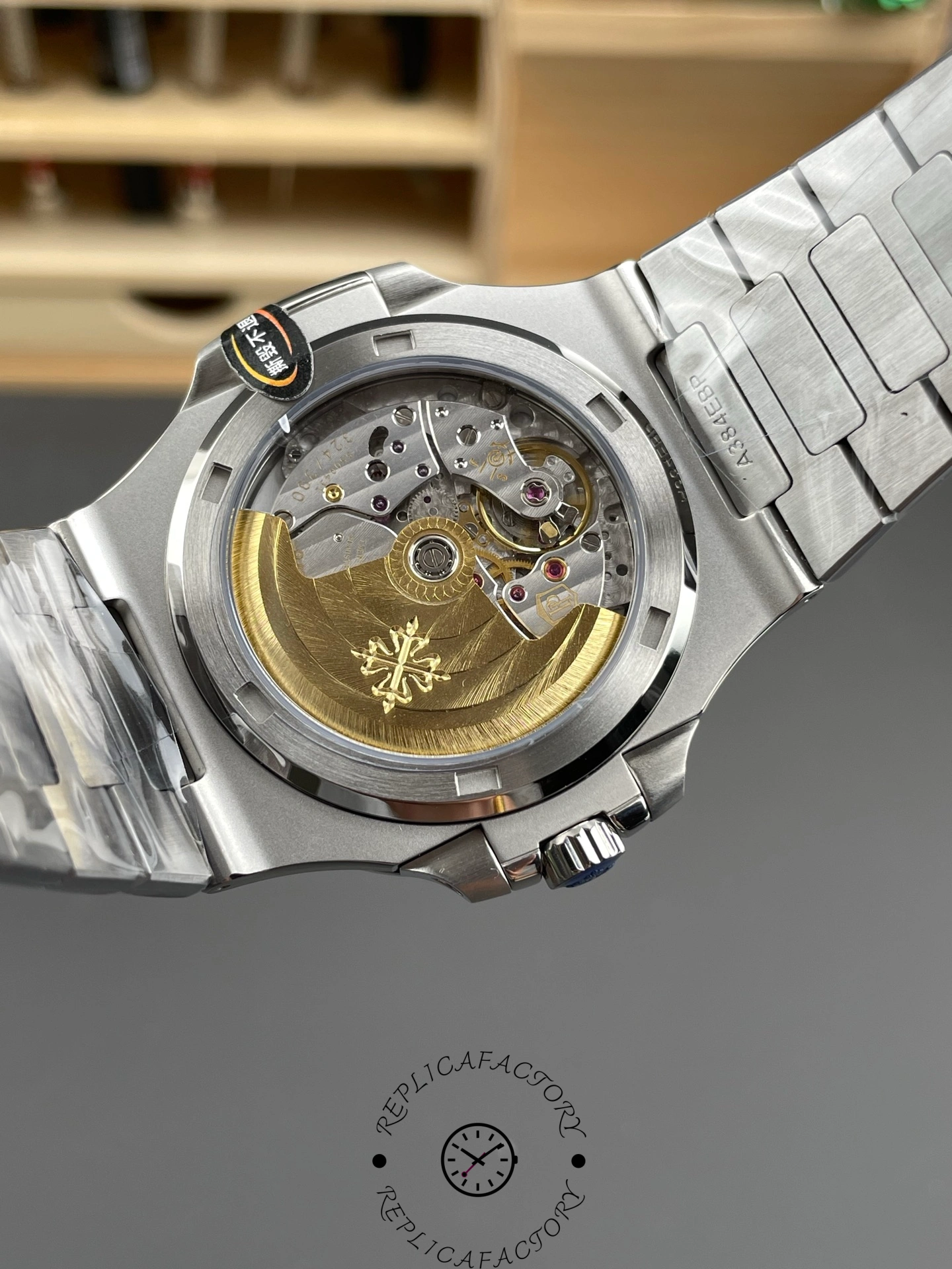 Caseback close-up of Patek Philippe Nautilus 5711/1A showing rotor and movement finishing.