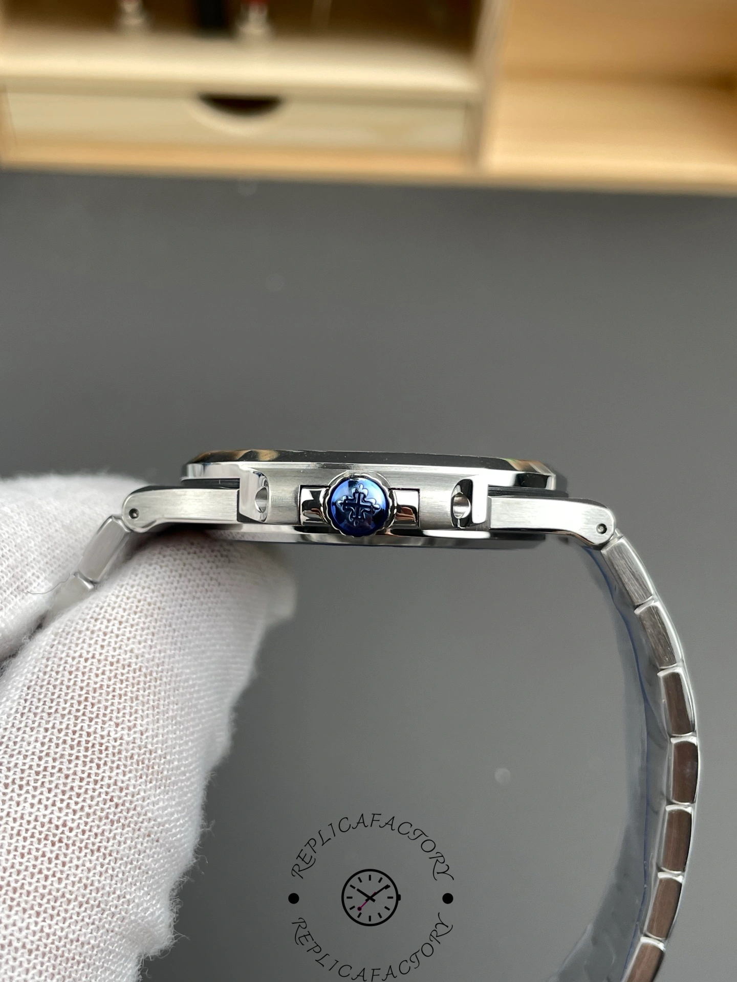 Side view of Patek Philippe Nautilus 5711/1A showing crown, bracelet articulation and slim profile.