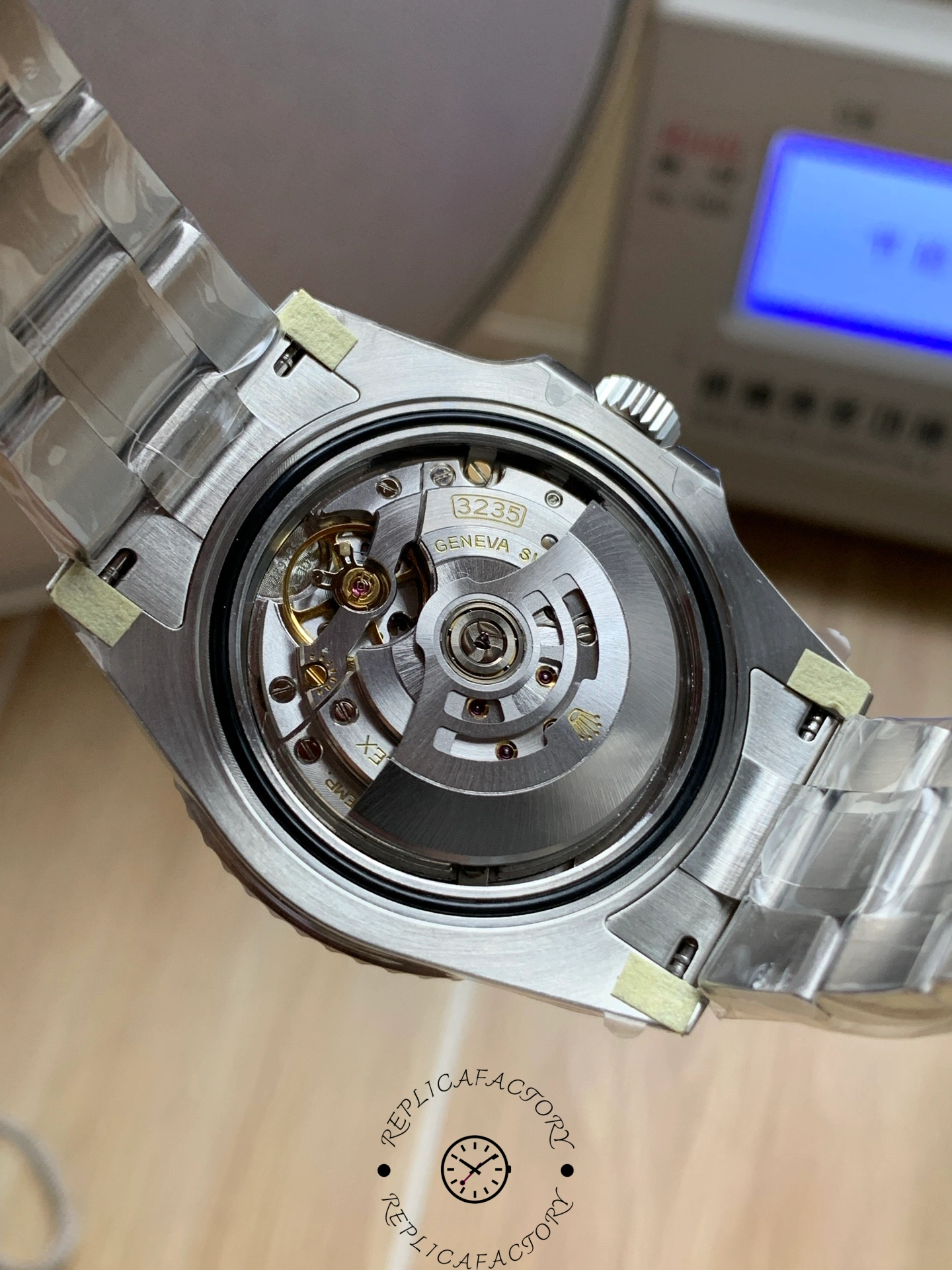 Rolex Submariner 126610LV, open caseback view revealing the automatic rotor movement.