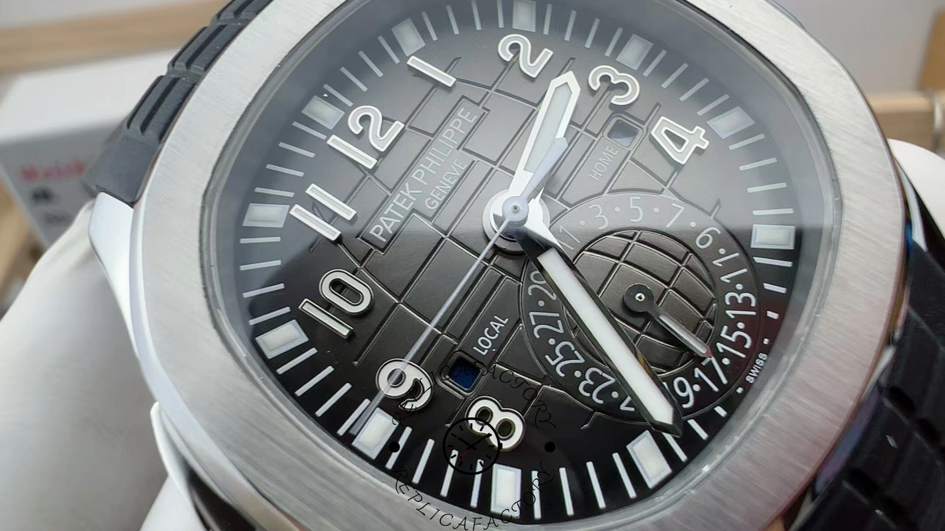 Macro shot of the Patek Philippe Aquanaut 5164A-001 dial and hands, showing minute track details.