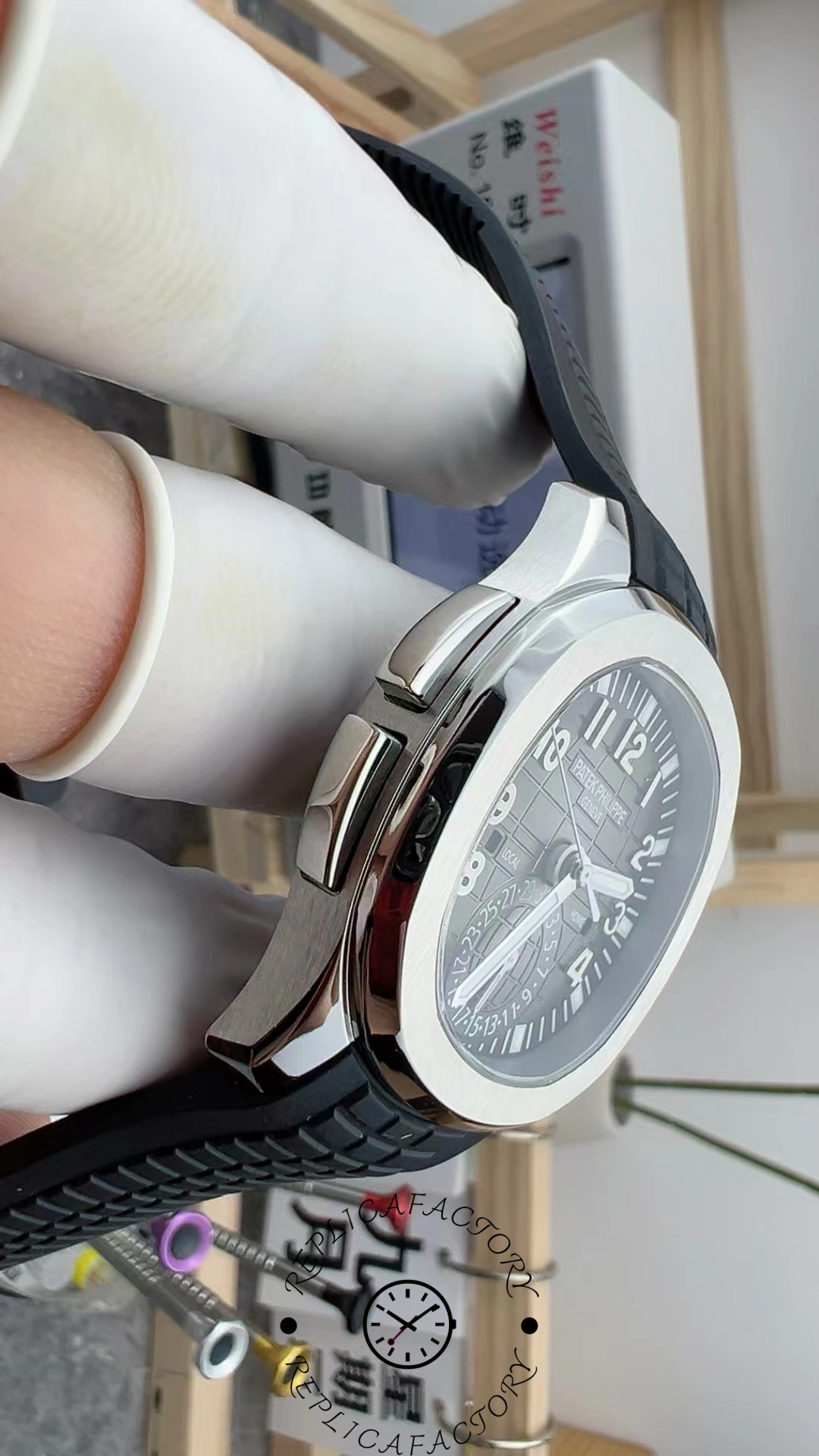 Side profile of the Patek Philippe Aquanaut 5164A-001 case, showing thickness and polished bezel.