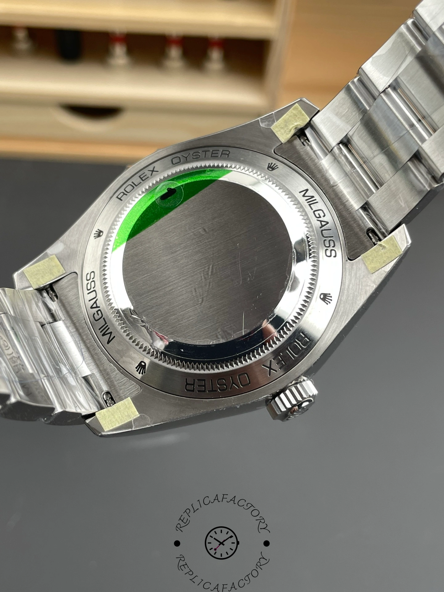 Rolex Milgauss 116400GV, caseback view showing solid back and bracelet end links.