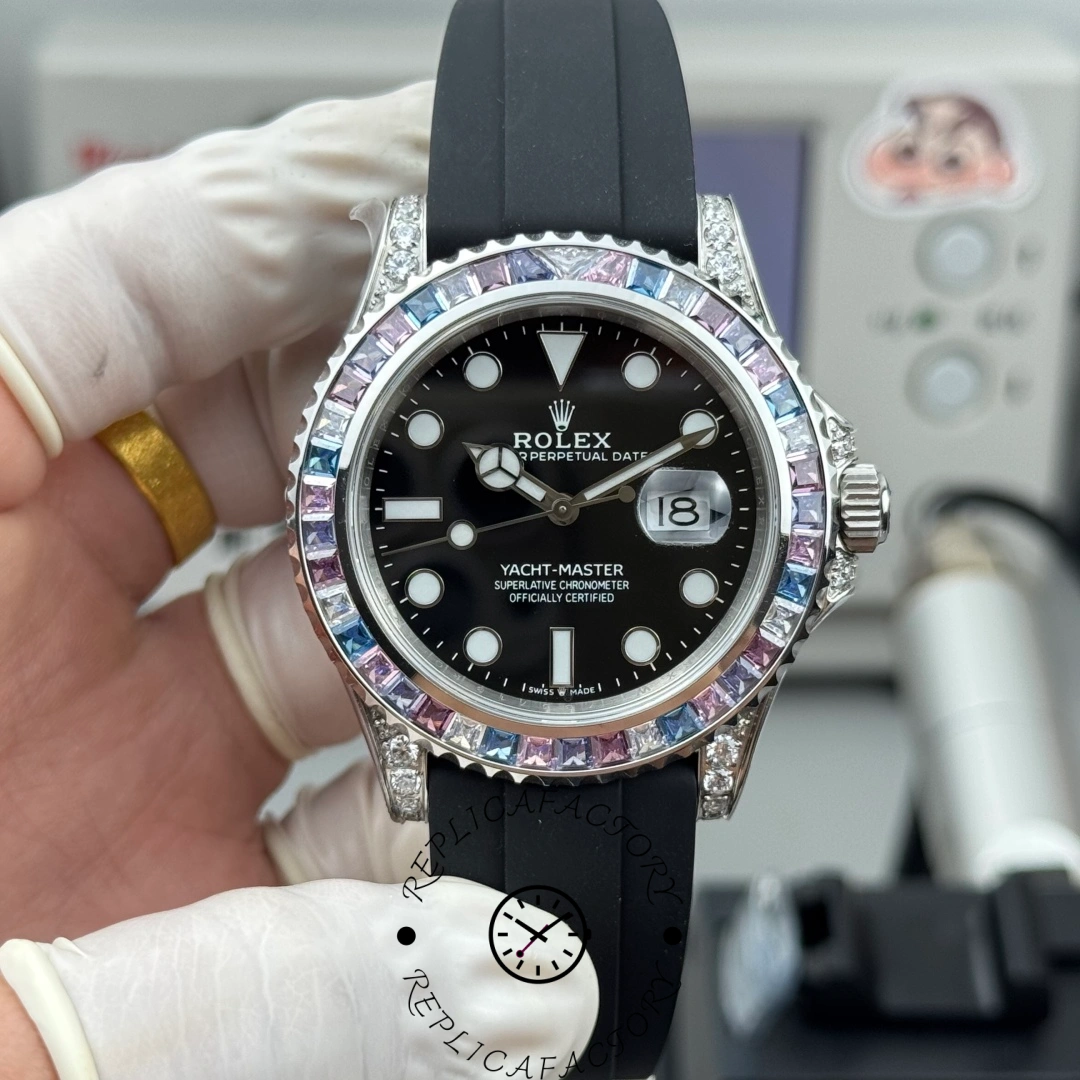 Handheld front view of the Rolex Yacht-Master 40 126679SABR 0002 showing black dial and bezel.