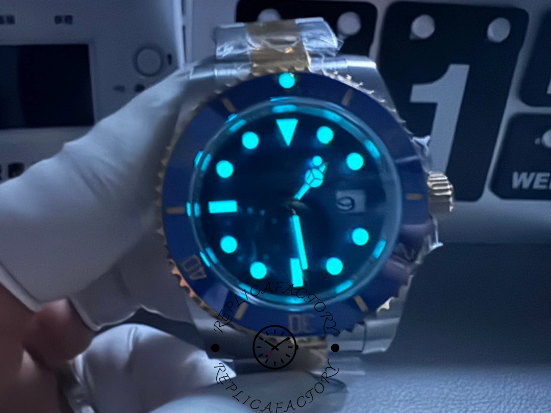 Rolex Submariner 126613LB lume shot, blue glow on markers and hands in dark scene.