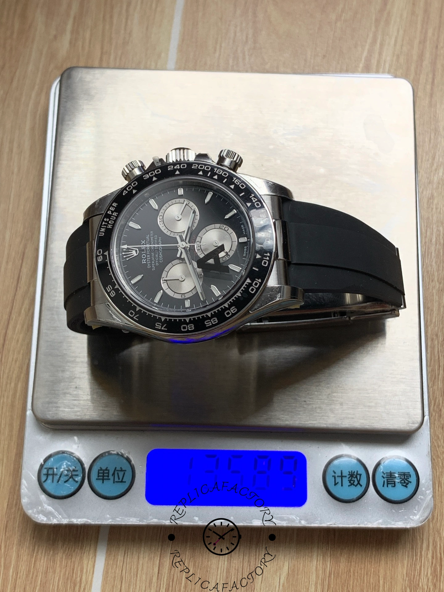 Weighing image of Rolex Cosmograph Daytona 126519LN on digital scale showing total weight.