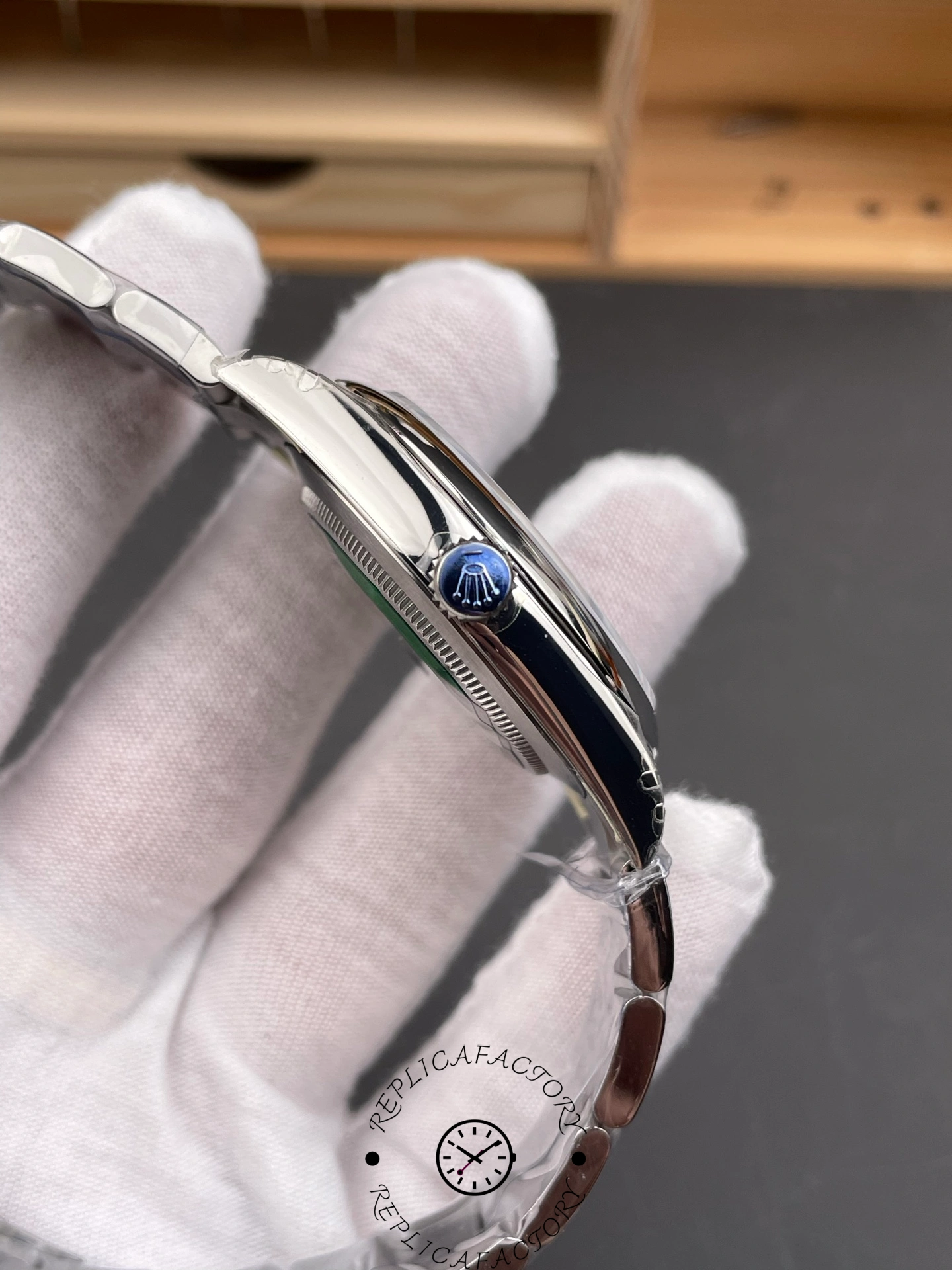 Side angle of Rolex Oyster Perpetual 134300 0004 showing polished case flank and crown.