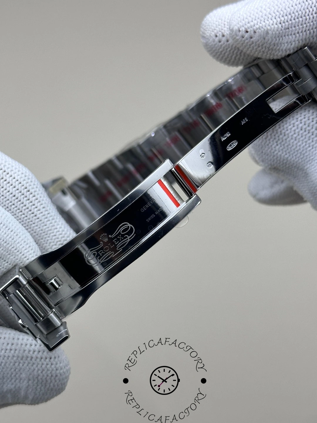 Rolex GMT-Master II 126719 0002 bracelet removed, clasp open, held in glove, side view.