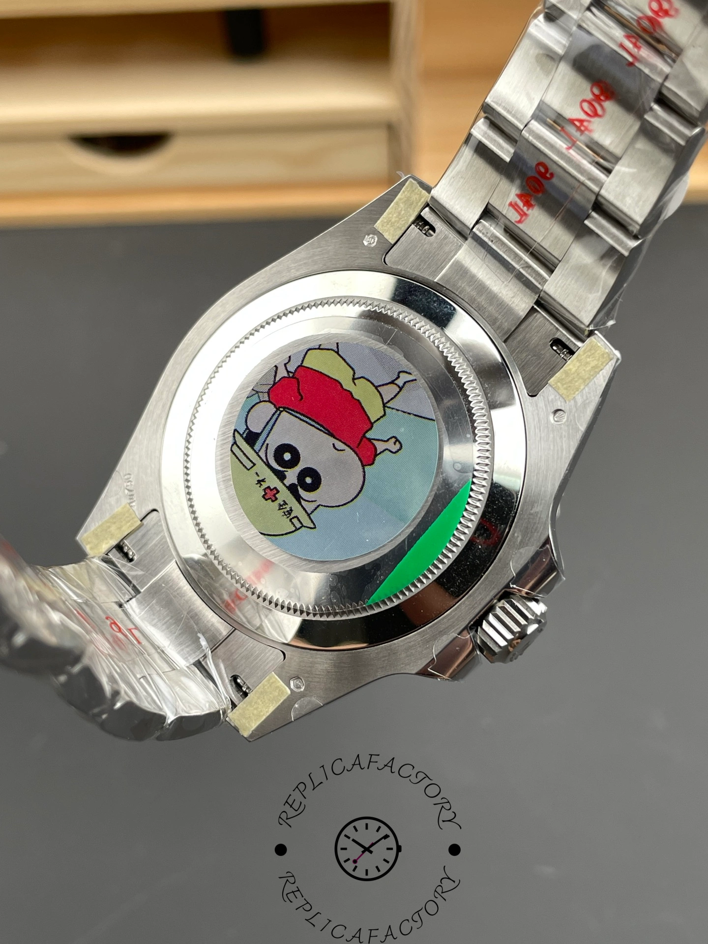 Rolex GMT-Master II 126719 0002 case back view, stickers and Oyster bracelet, rear angle.