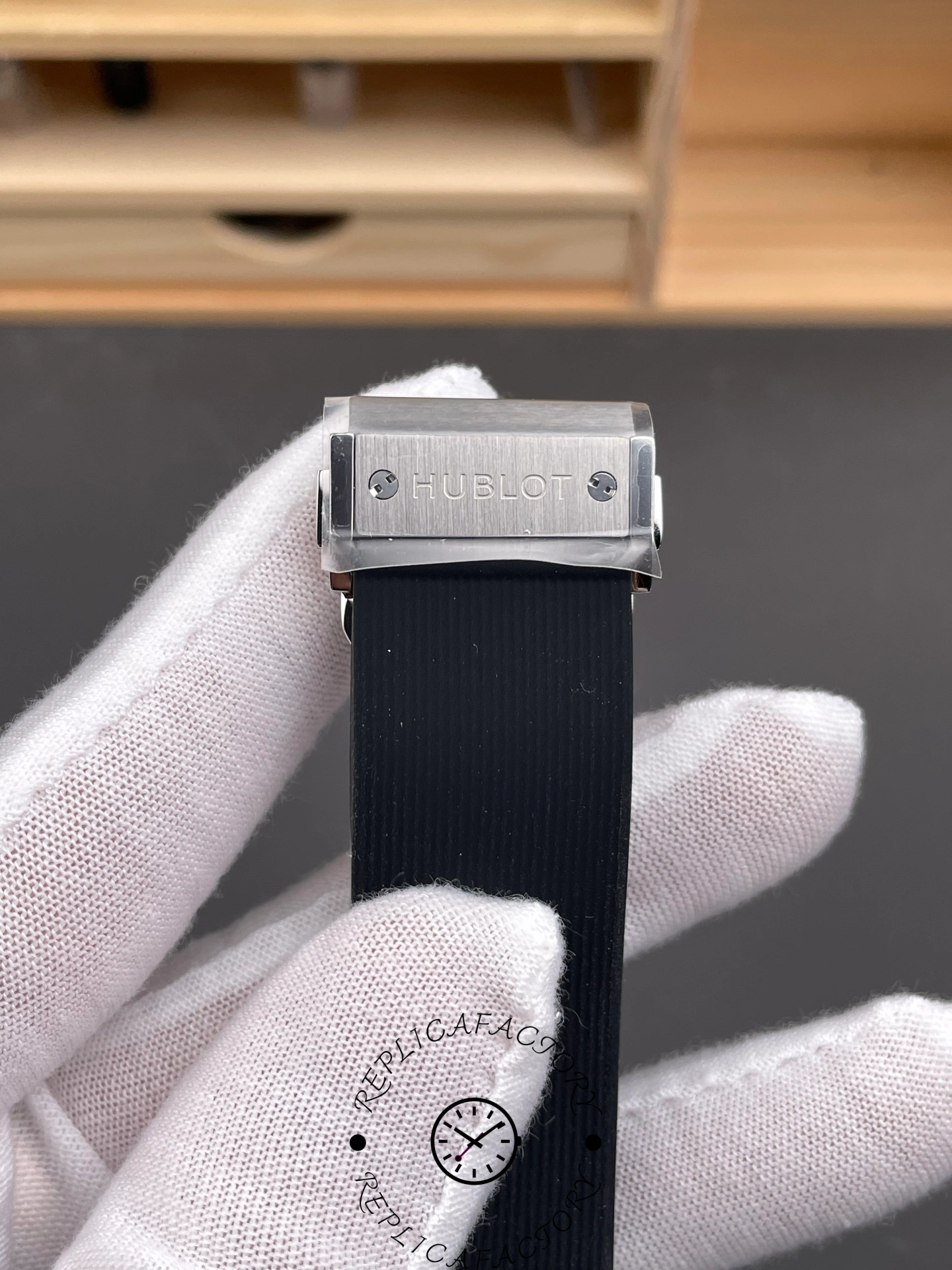 Clasp detail of Hublot Classic Fusion 542.NX.1171.RX, deployant buckle on black rubber strap.