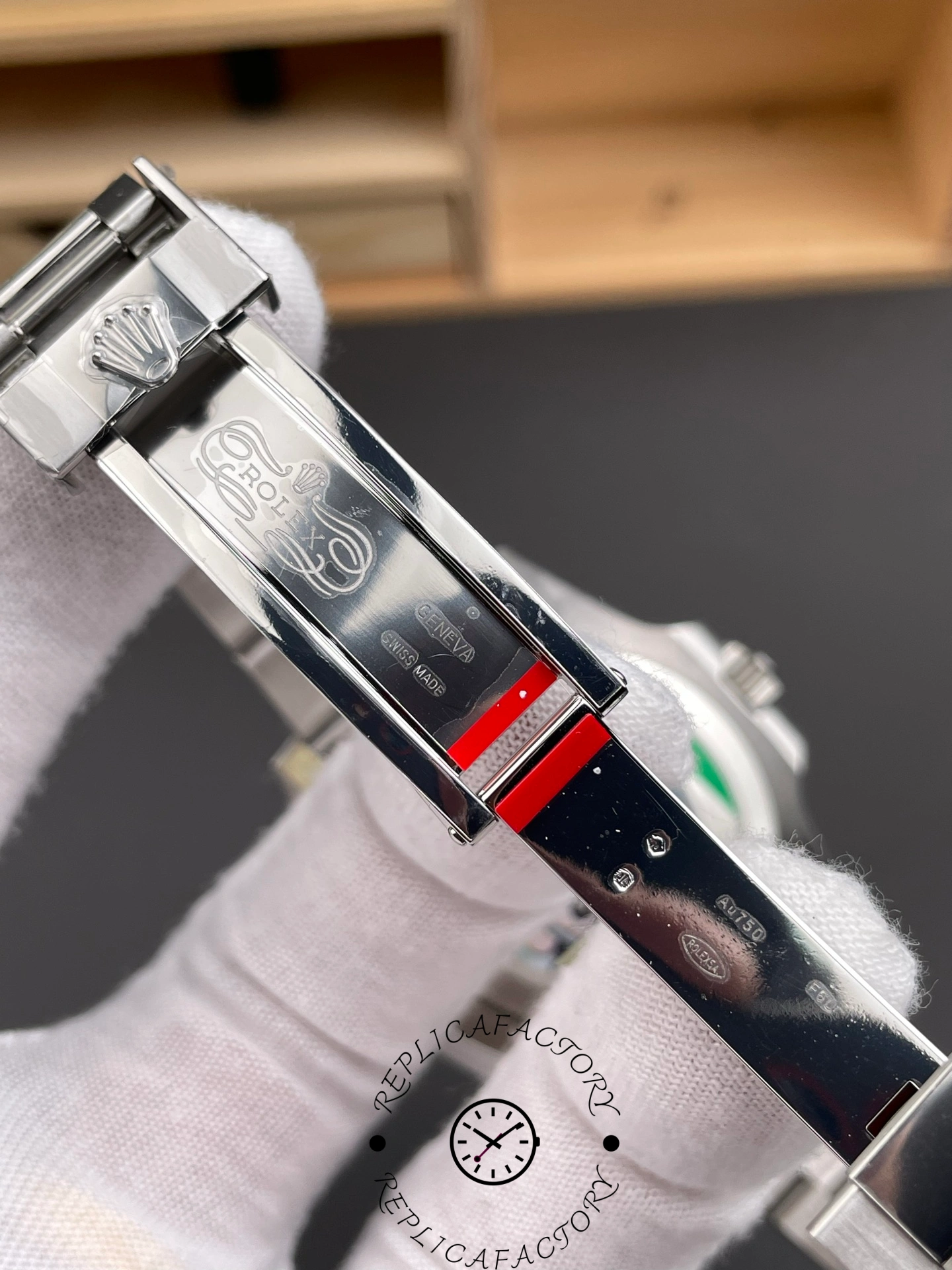 Rolex GMT-Master II 126719 0002 clasp close-up, Oyster clasp engraving detail, in glove.