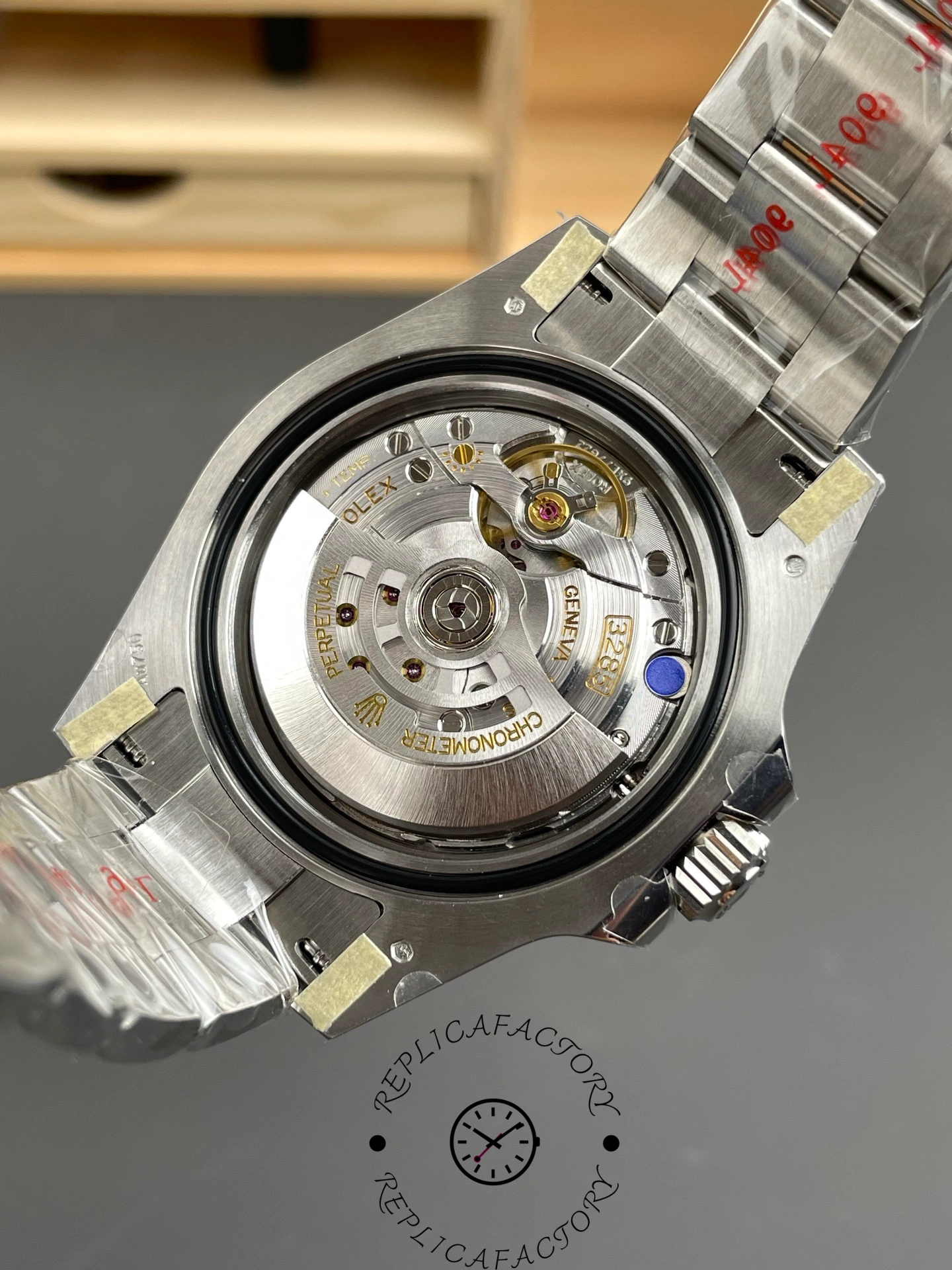 Rolex GMT-Master II 126719 0002 movement view, open case back showing rotor and mechanism.