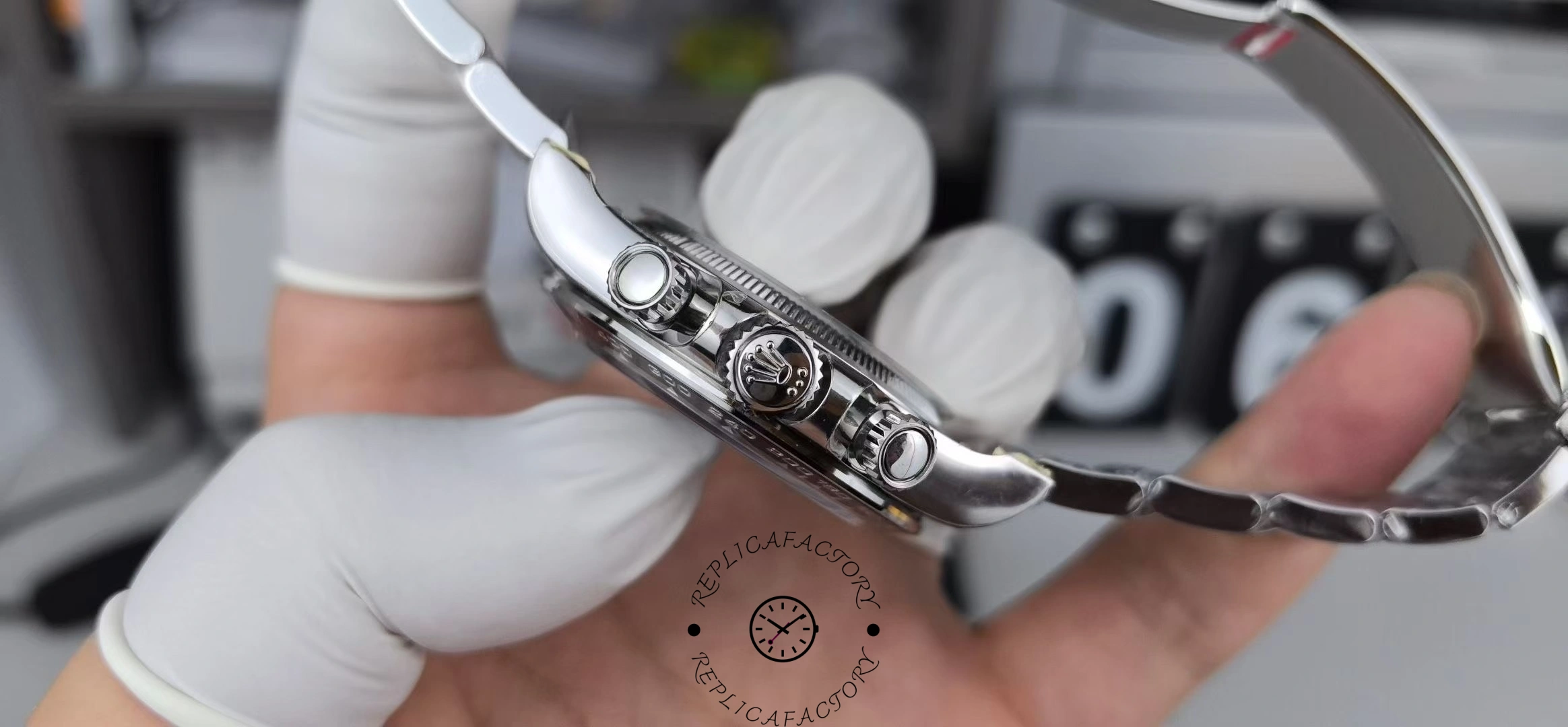 Gloved side view of the Rolex Platinum Cosmograph Daytona 126506 0002 showing crown and bracelet link.
