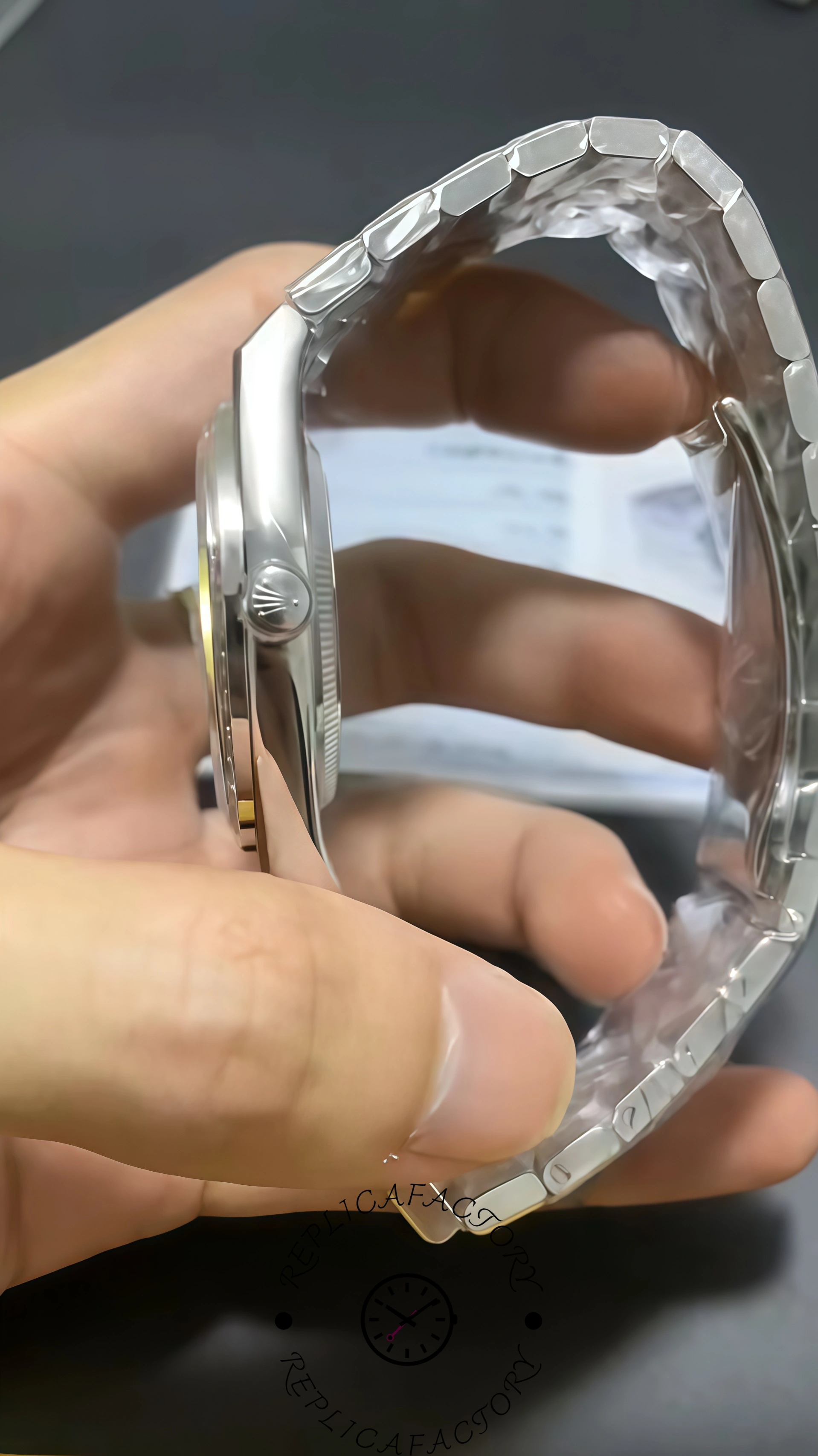 Side profile of Rolex Land-Dweller 40 127386TBR-0001 Replica showing case thickness and screw-down crown.