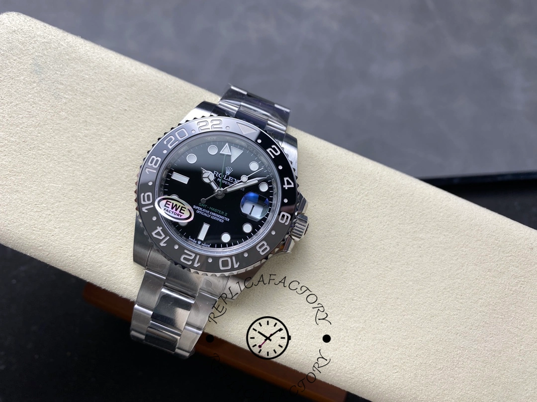 Rolex GMT-Master II M126710GRNR 0004 top view on cushion, black dial and bezel, bracelet visible.