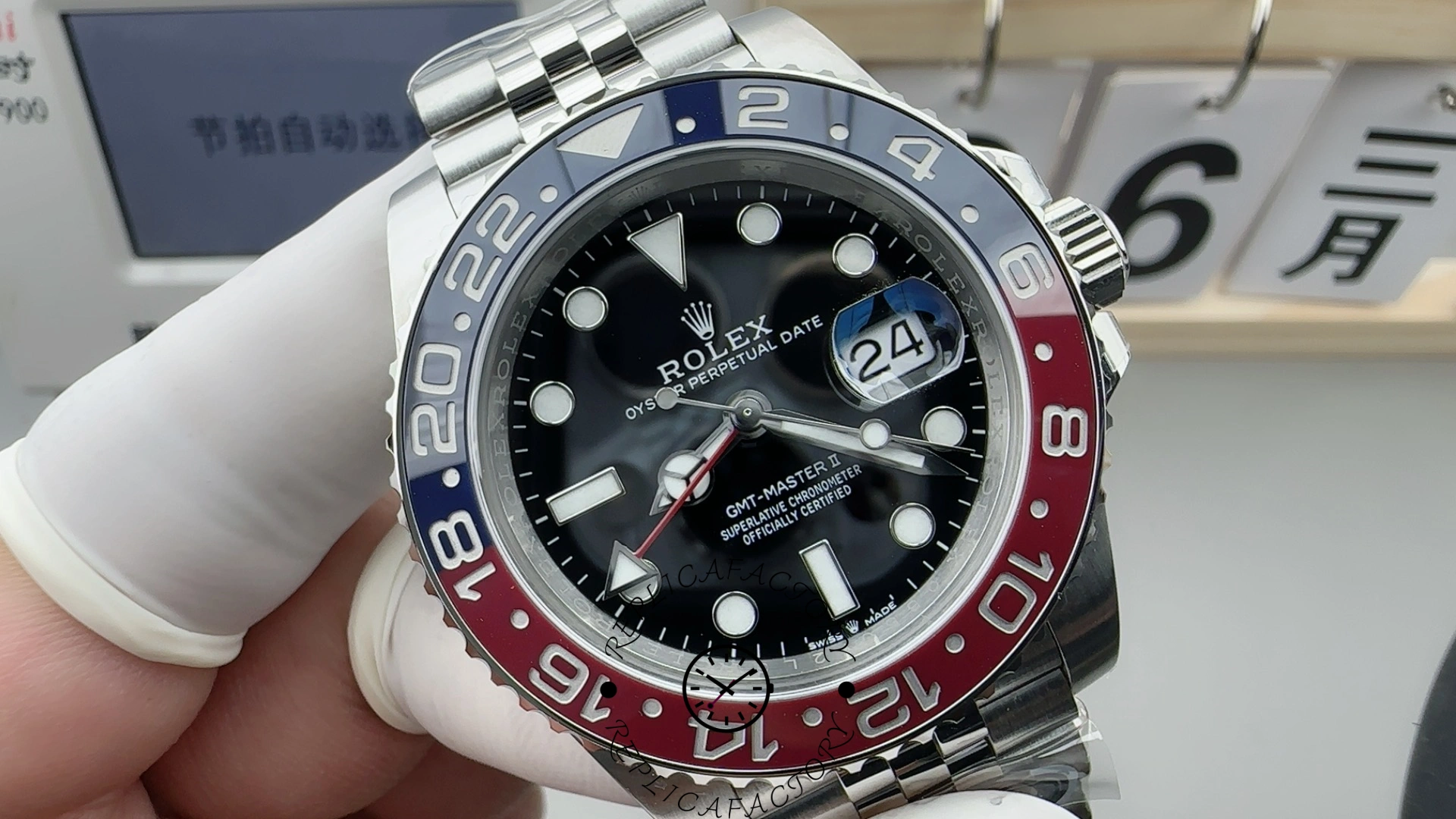 Rolex GMT-Master II 126710BLRO, hand-held close-up showing black dial and Pepsi bezel.