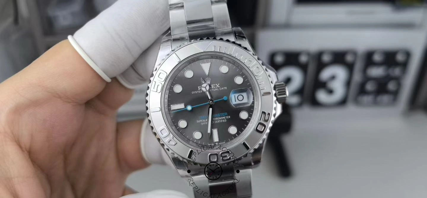 Handheld close-up of the Rolex Yacht-Master 126622 showing grey dial and platinum bezel.