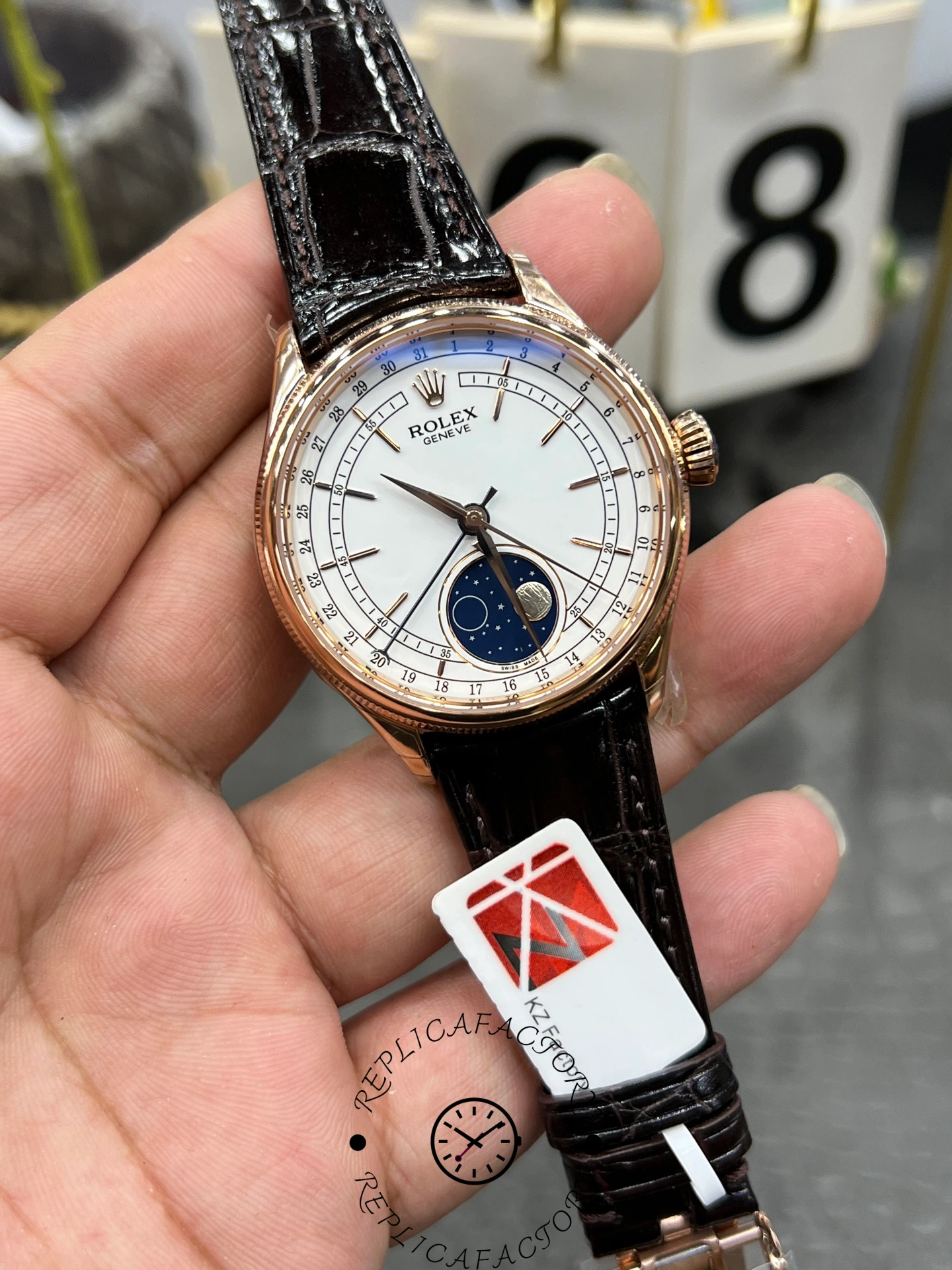 Rolex Cellini 50535 0002 39mm, angled dial close-up highlighting applied markers and moonphase display.