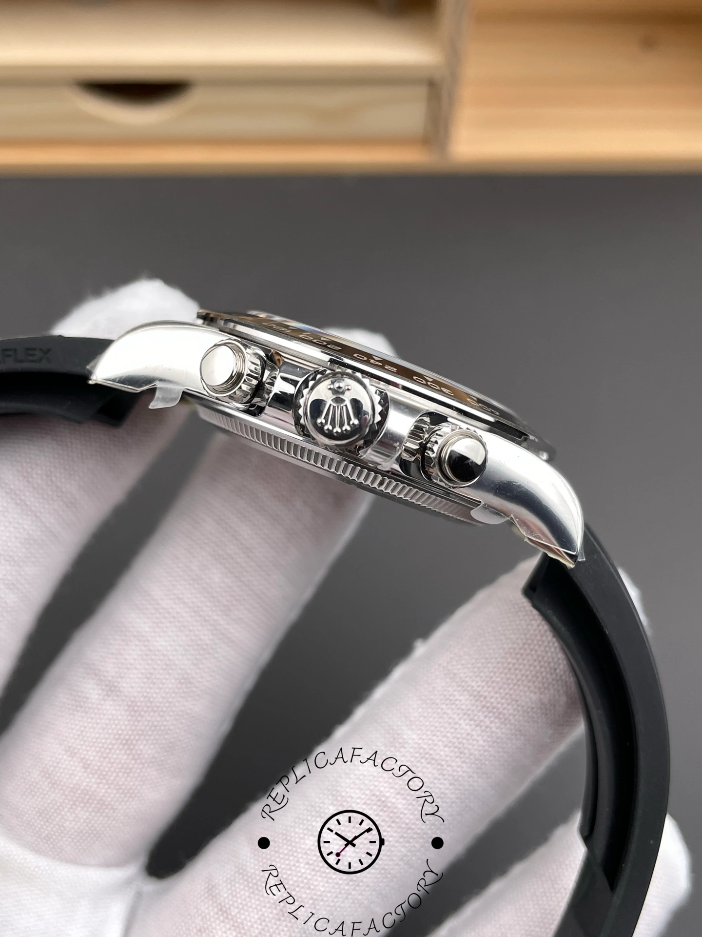 Side view of the Rolex Cosmograph Daytona White Gold 126519LN 0004 with crown and pushers.