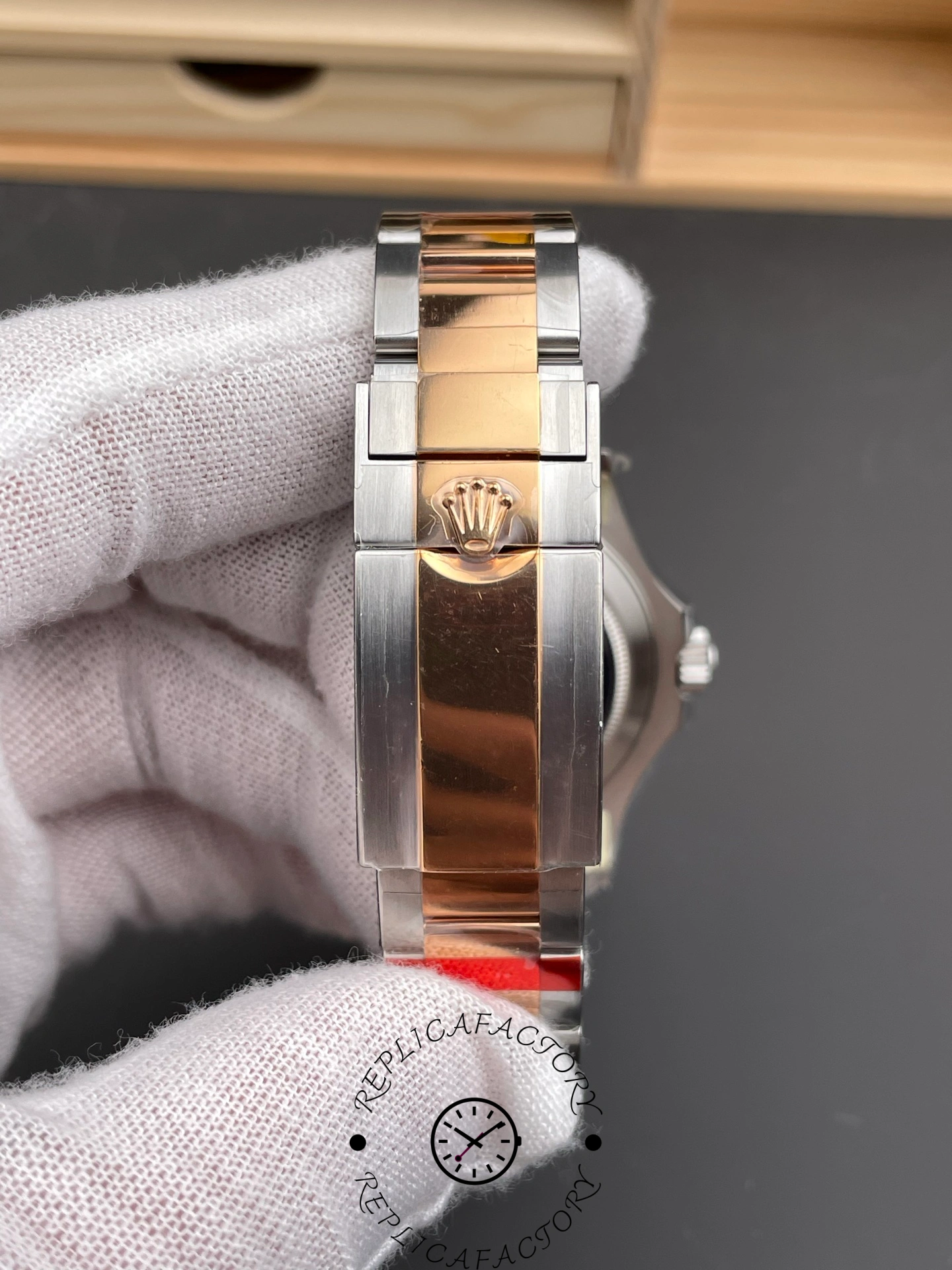 Rolex Yacht-Master 126621 bracelet clasp view, clasp and links detail, held in glove.