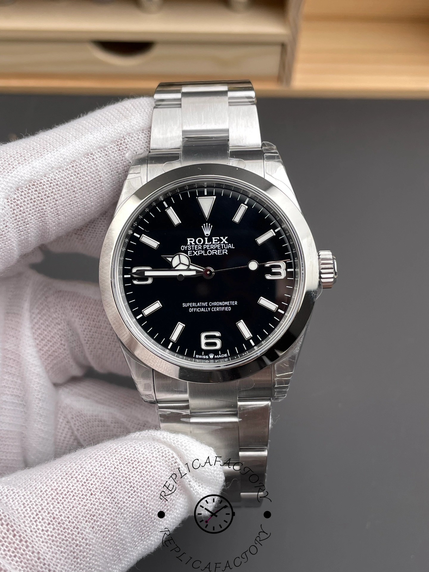 Rolex Explorer 224270, hand-held front view showing black 3-6-9 dial and steel bracelet.