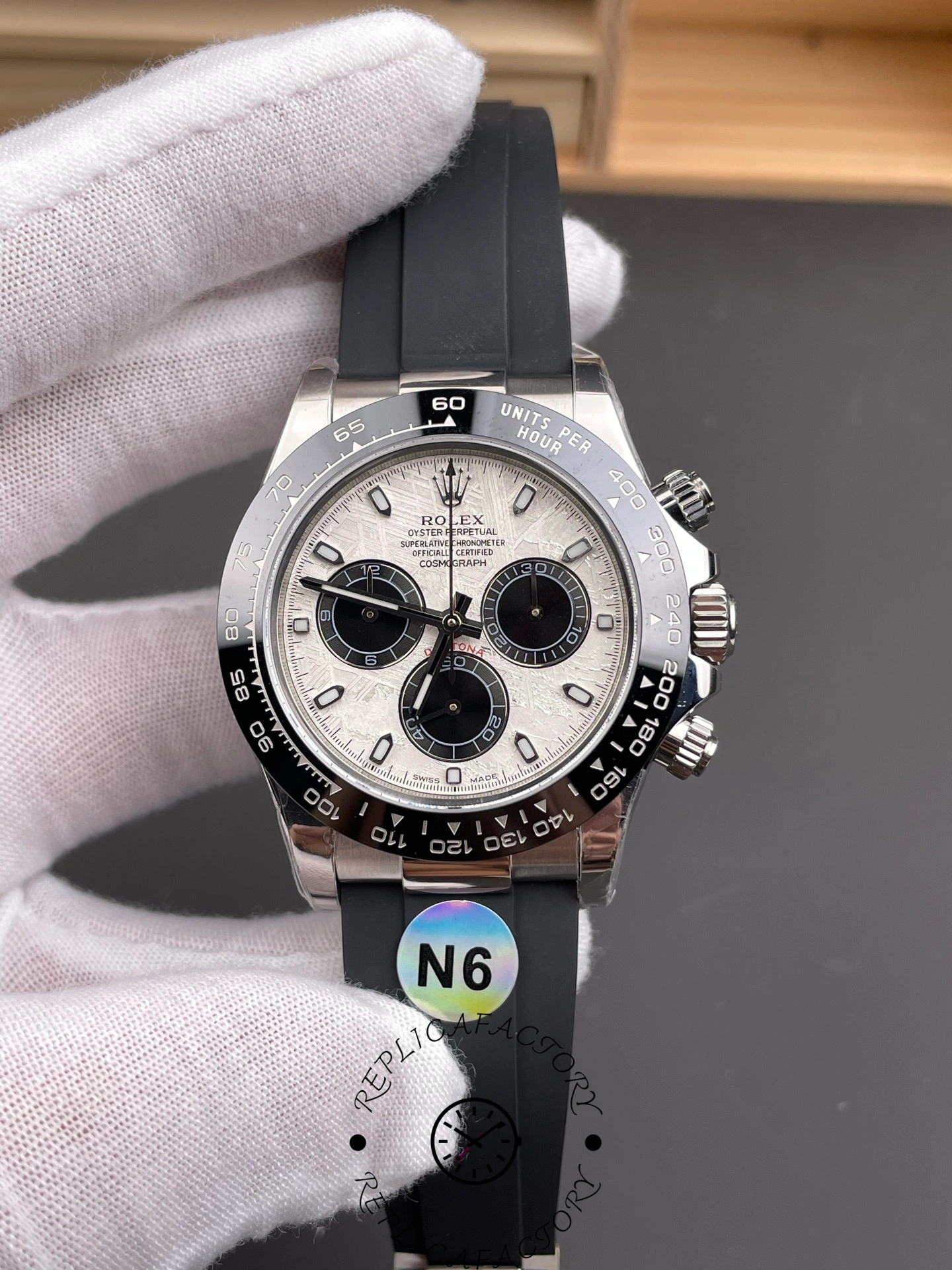 Rolex Daytona 126519LN 0007, front view in hand showing white dial and subdials.