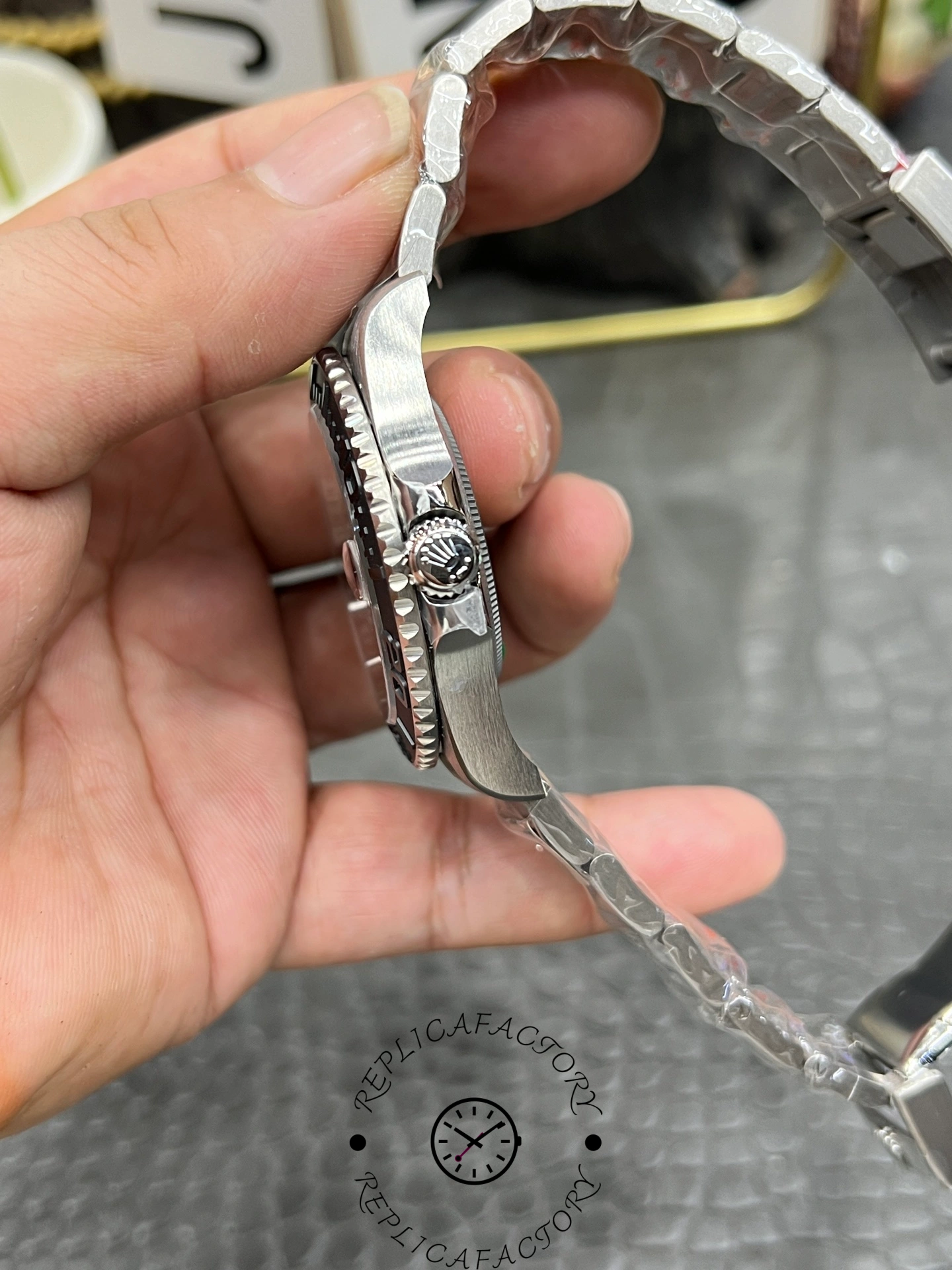 Rolex Yacht-Master 42 226627 0001, side view showing crown, bracelet thickness and clasp area.