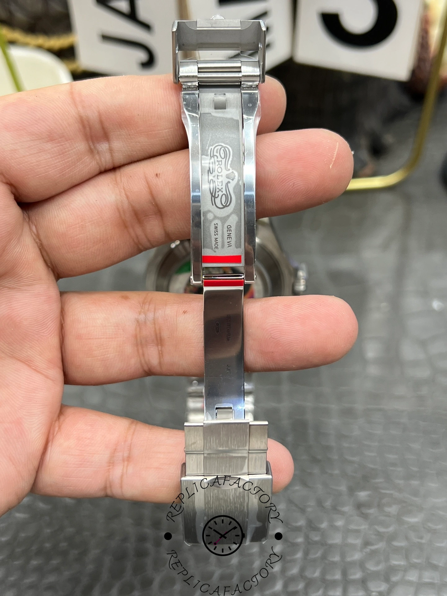 Rolex Yacht-Master 42 226627 0001, bracelet back view showing full clasp section in hand.