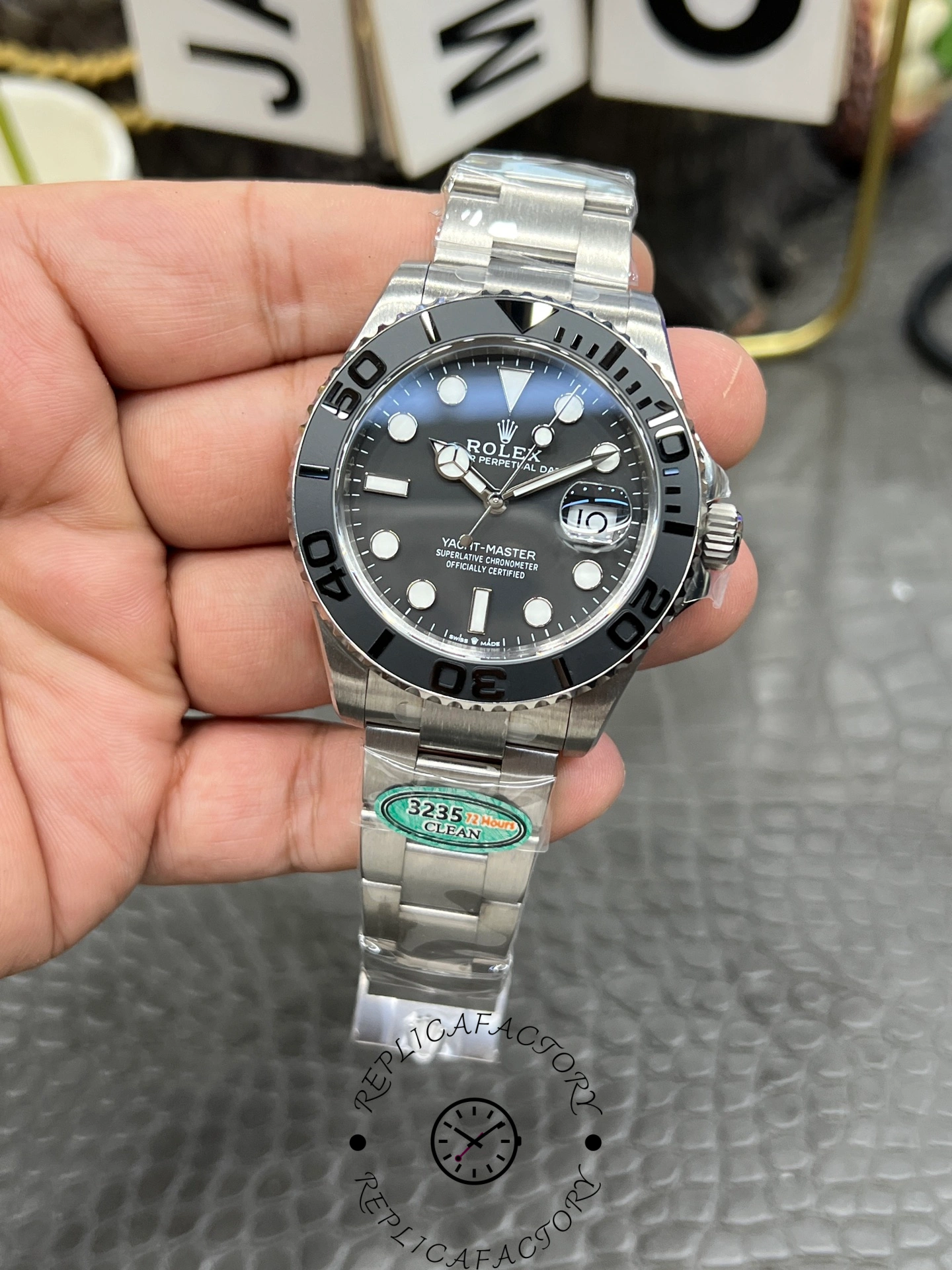 Rolex Yacht-Master 42 226627 0001, hand-held angled view showing case and bracelet links.