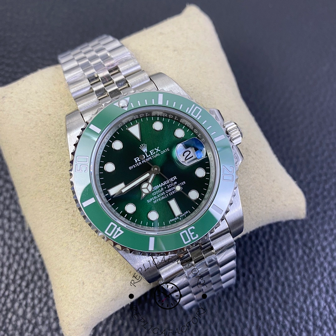Angled view of Rolex Submariner 116610LV on cushion, green bezel and dial.