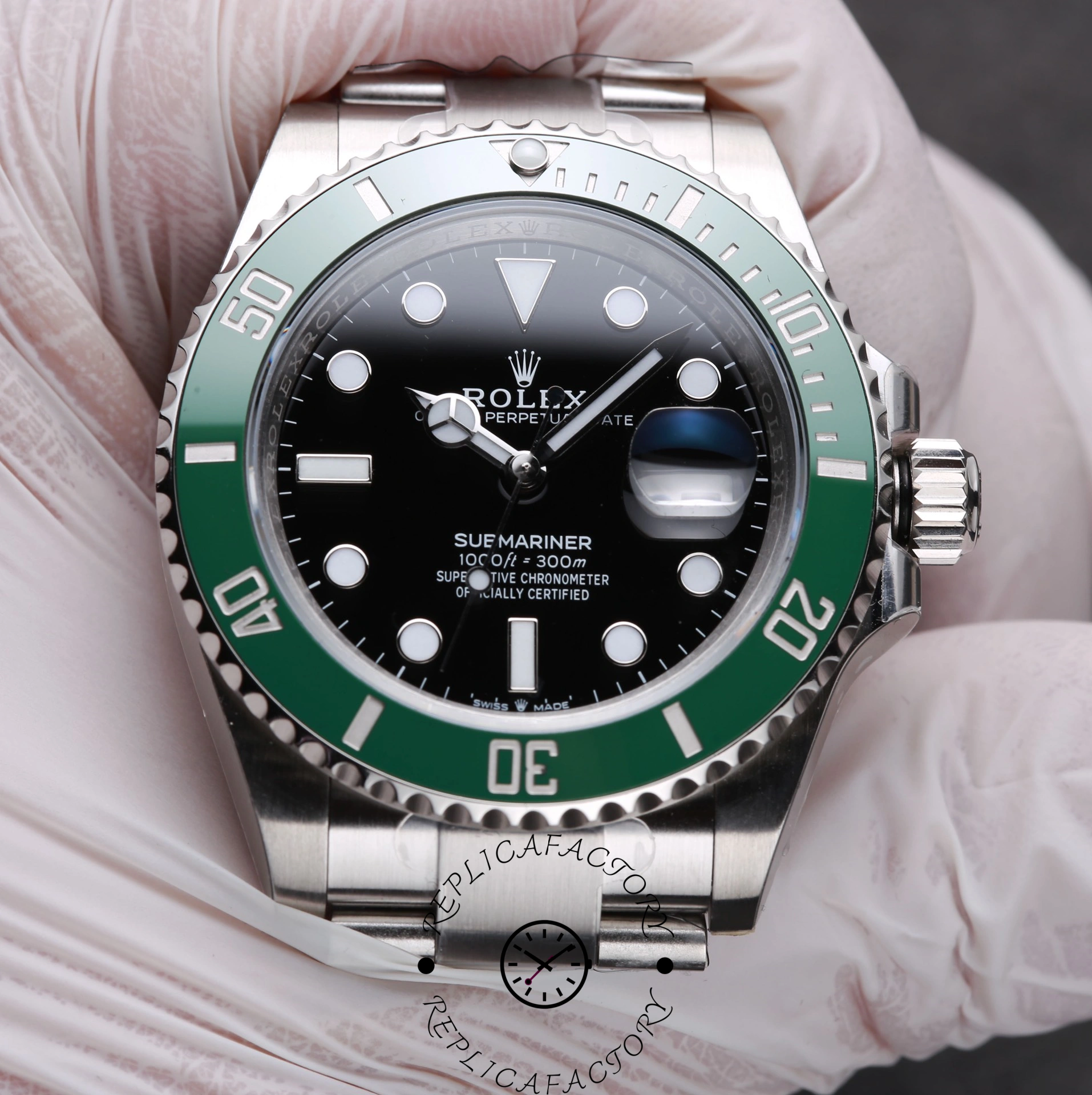 Rolex Submariner 126610LV, gloved hand holding the watch, green bezel text visible.