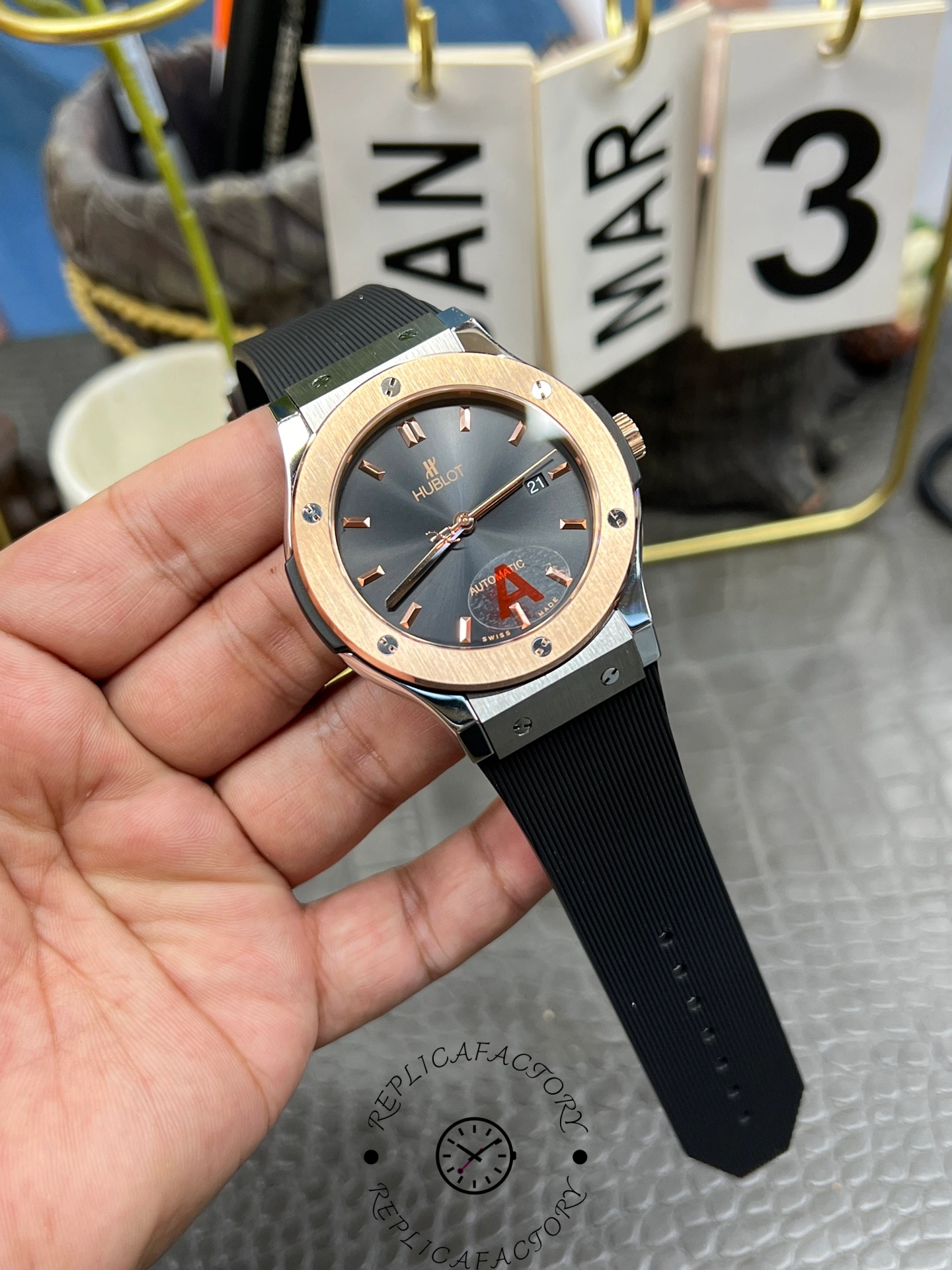 Handheld front view of Hublot Classic Fusion 542.NO.1181.RX showing the full dial layout and rose-gold case.