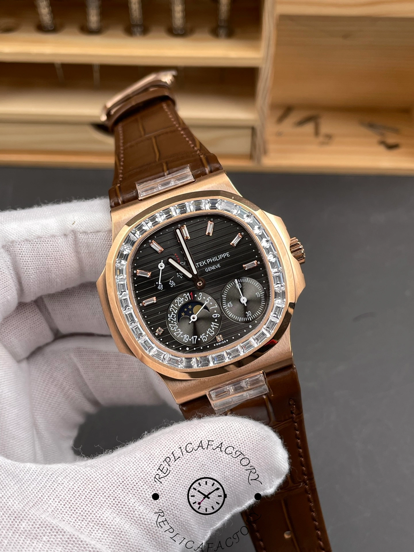 Angled close-up of Patek Philippe Nautilus 5724-001 showing moonphase subdial and applied indices.