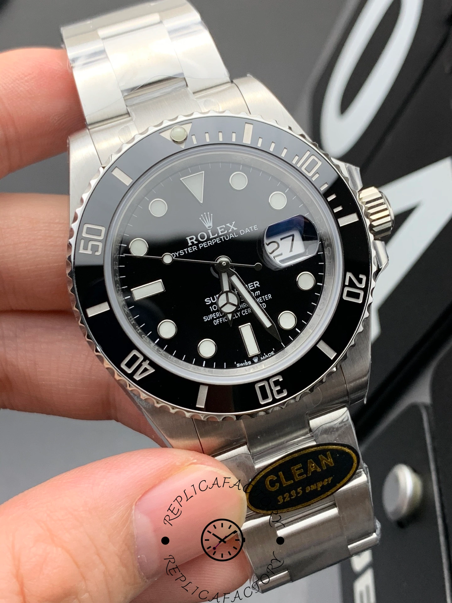 Rolex Submariner 116610LN 0001, dial close-up showing minute track, markers, and date magnifier.