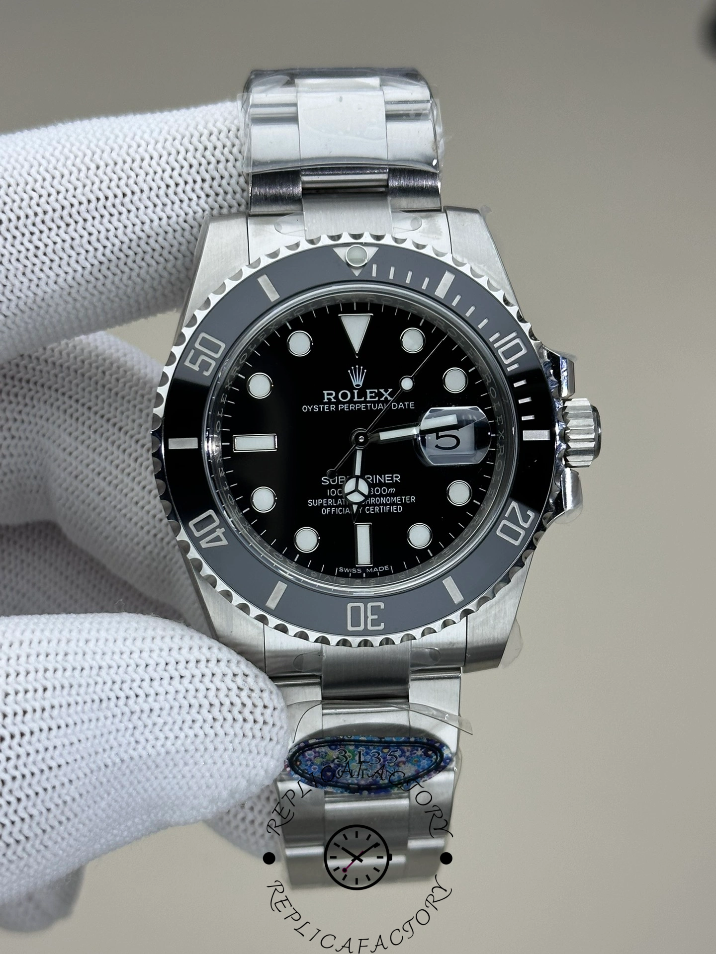 Rolex Submariner 116610LN 0001, gloved-hand front view highlighting luminous hour markers and Mercedes hands.