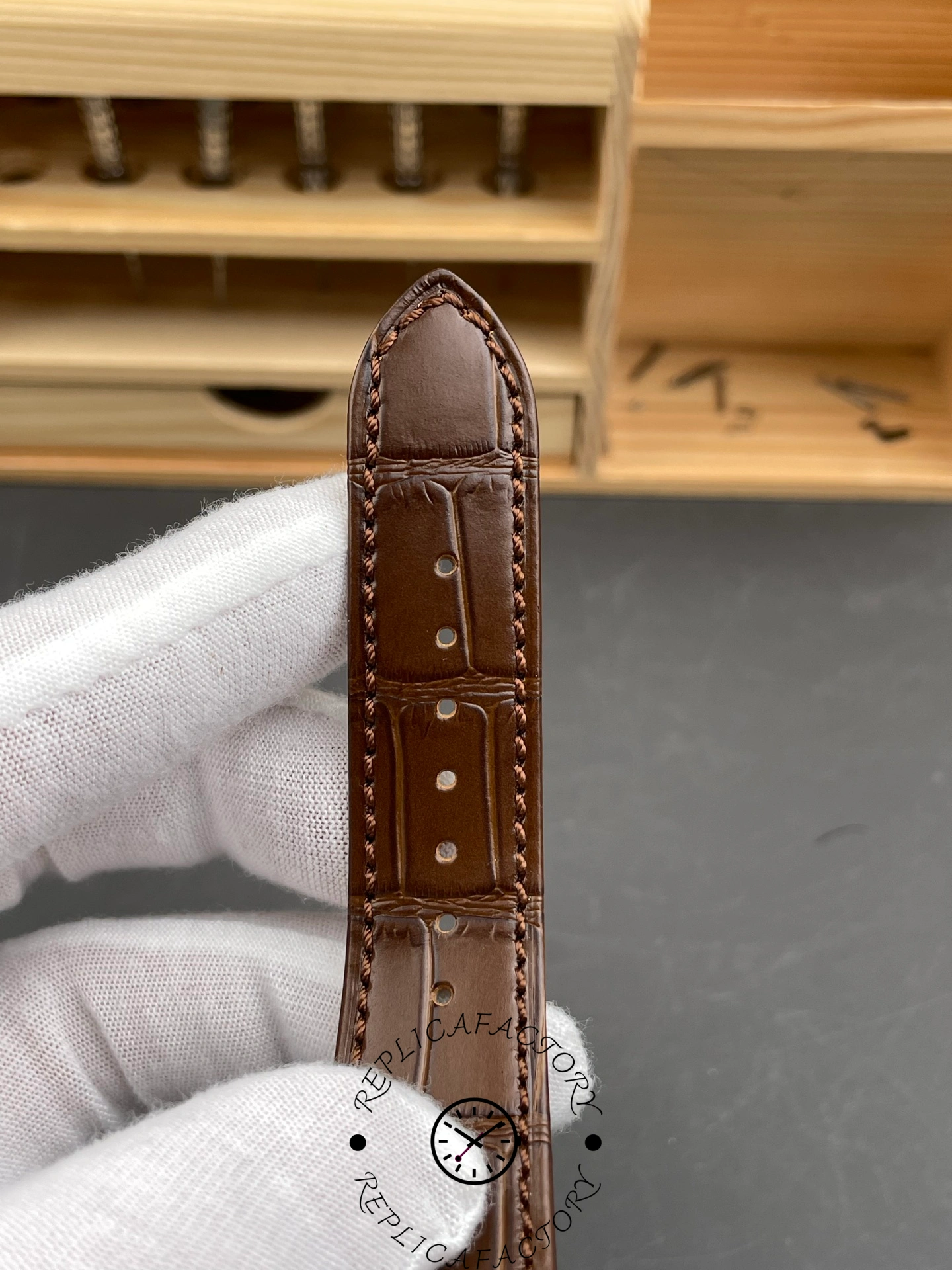 Brown leather strap back view for Patek Philippe Nautilus 5724-001 showing stitching and strap holes.