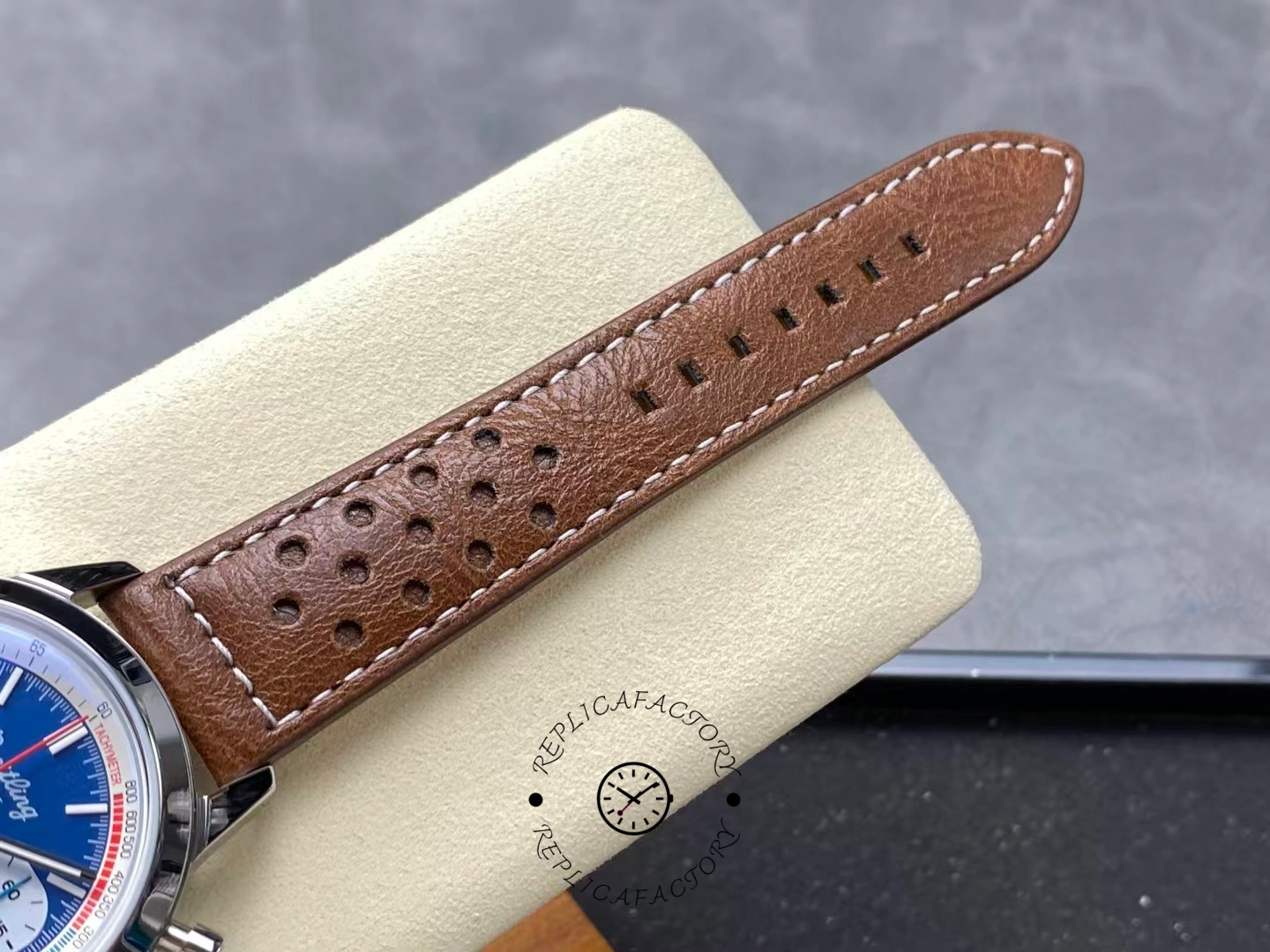 Breitling Top Time B01 Shelby Cobra AB01763A1C1X1, strap close-up showing perforations and finish.