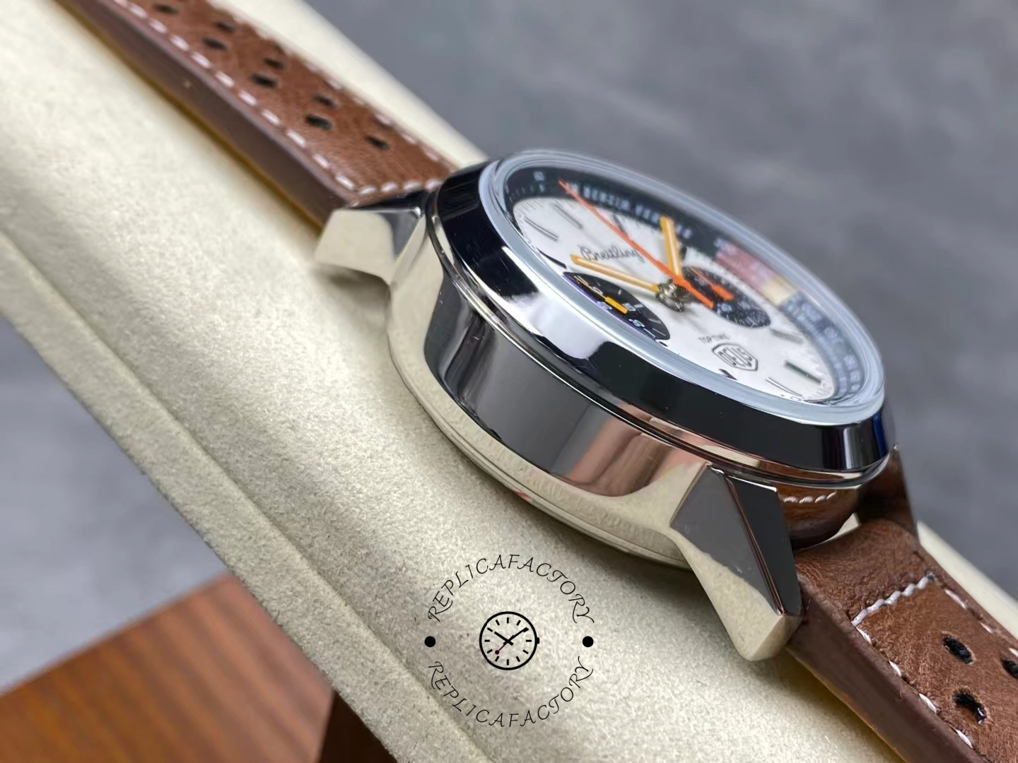 Breitling Top Time Deus A233101A1A1X1, side profile on cushion showing case thickness.