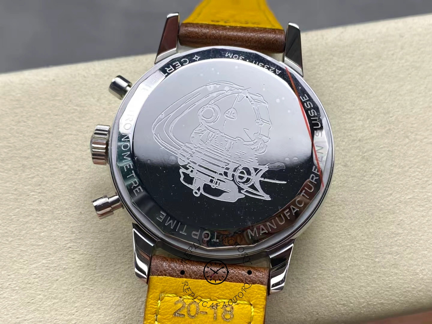 Breitling Top Time Deus A233101A1A1X1, caseback view showing engraved back and serial area.