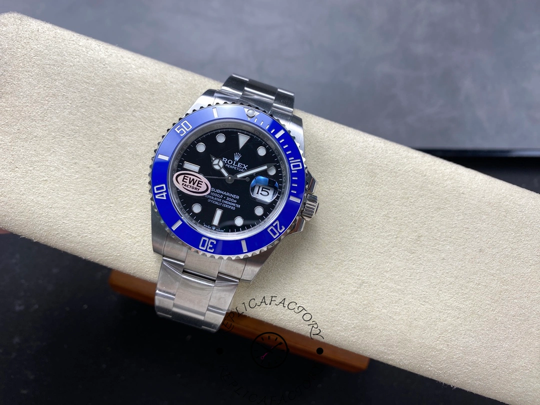 Rolex Submariner 126619LB 0003, on cushion, angled wrist-style view.