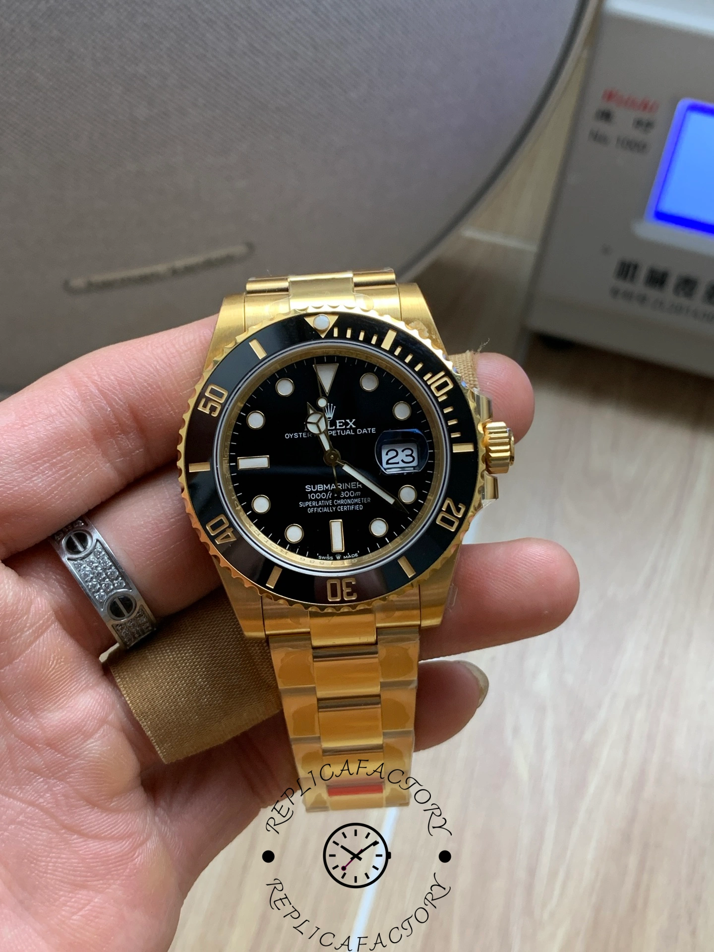 Rolex Submariner 126618LN, front view with gold bracelet and clasp visible.