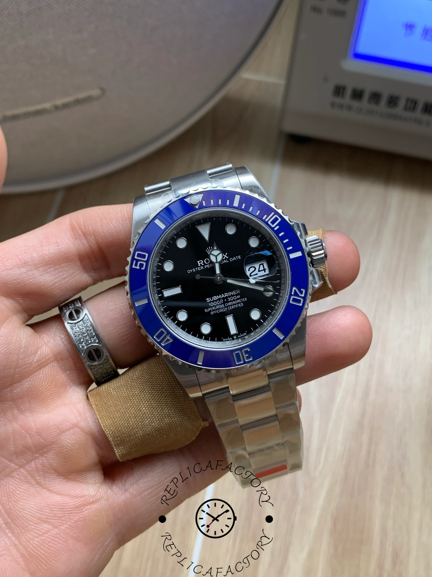 Rolex Submariner 126619LB 0003, close front view in hand showing dial clarity.