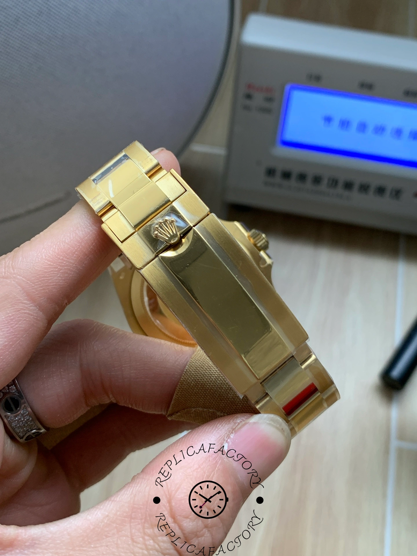 Rolex Submariner 126618LN, bracelet and clasp detail in hand.